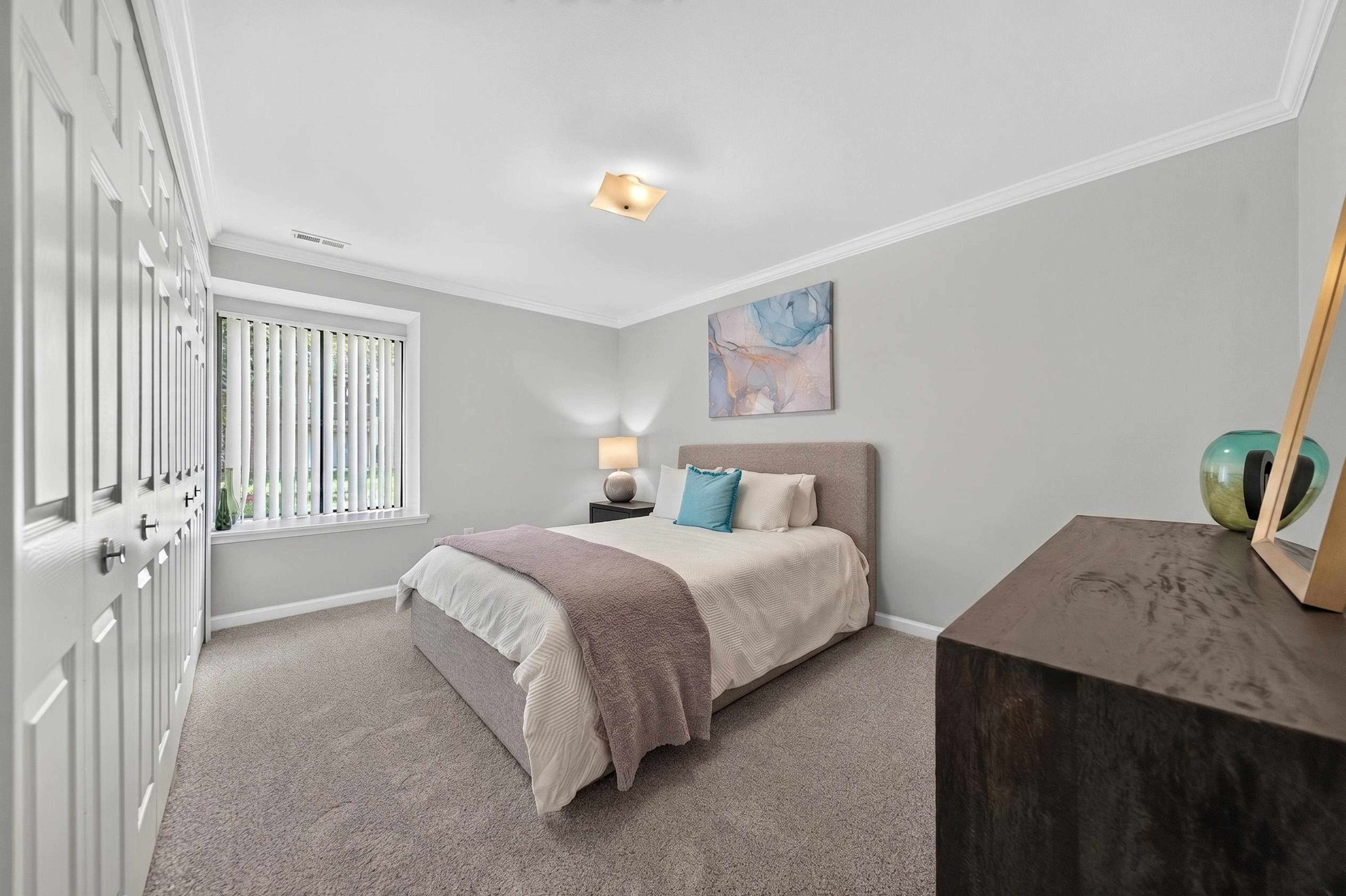 Spacious Bedroom at Lakeside Village Apartments in Clinton Township, MI.