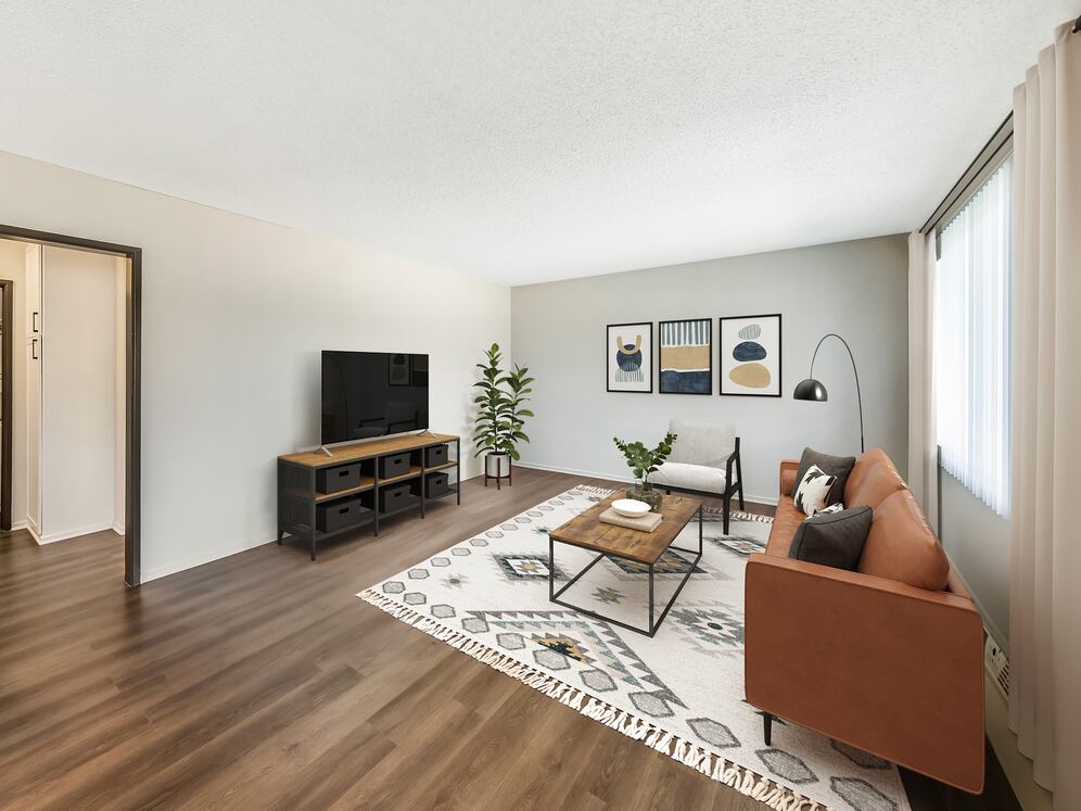 Renovated Package I living room with hard surface flooring (select homes)