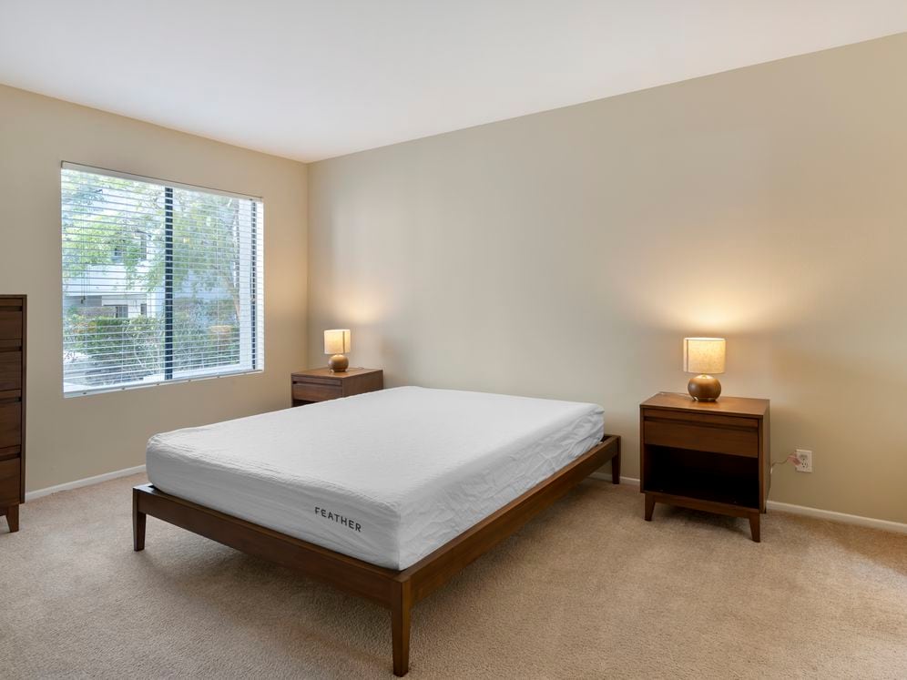 Furnished+ apartment homes feature queen bed with mattress, dresser, nightstands, and lamps.(Representative Image – exact items and style of furnishings may vary)