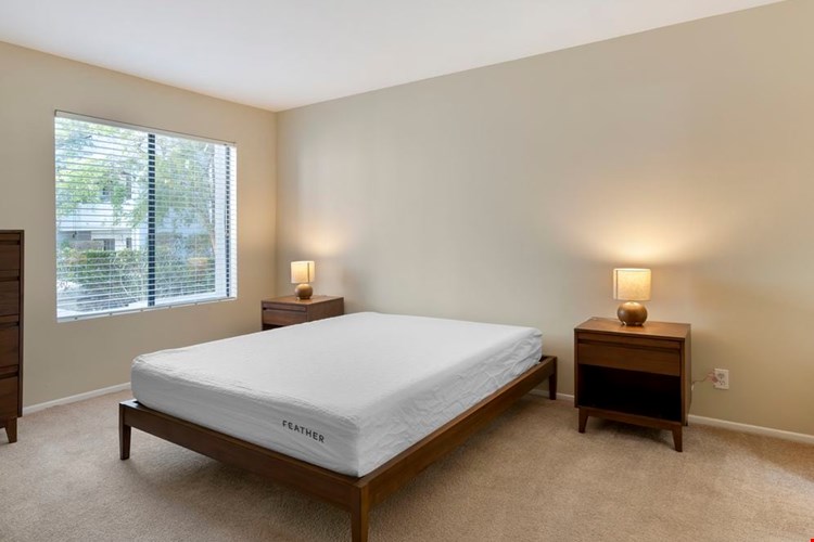 Furnished+ apartment homes feature queen bed with mattress, dresser, nightstands, and lamps.(Representative Image – exact items and style of furnishings may vary)