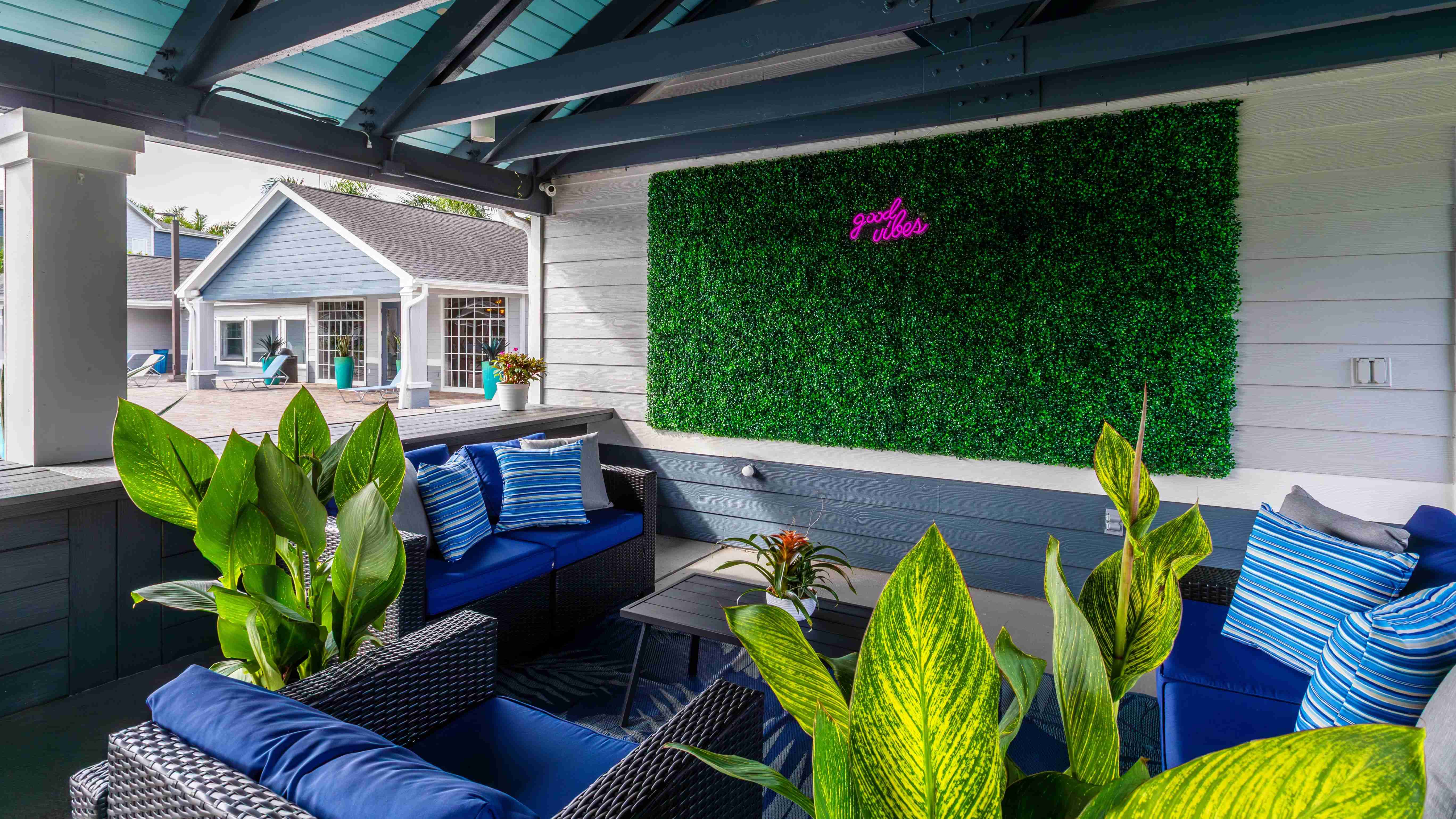 Sink into our comfortable outdoor lounge seating surrounded by lush greenery and playful décor designed to create the ultimate laid-back vibe.