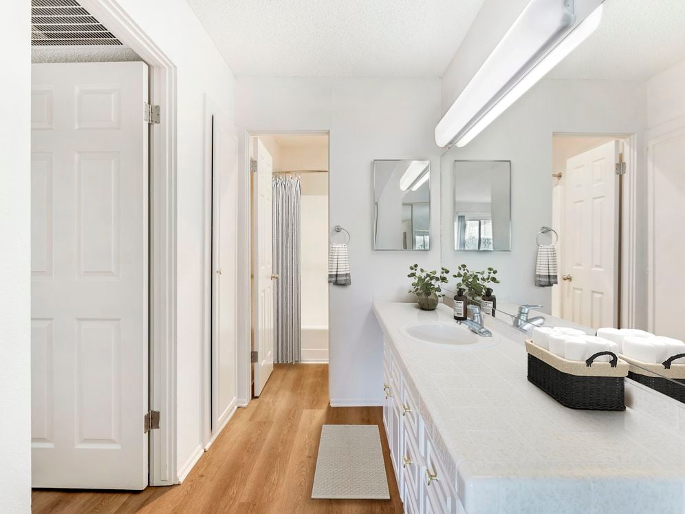 Classic Package II bath with white tile countertops, white cabinetry, and hard surface flooring