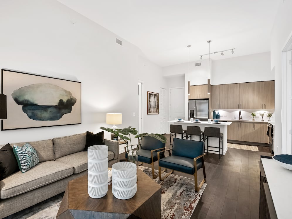 Kitchen, living, and dining areas with hard-surface vinyl plank flooring