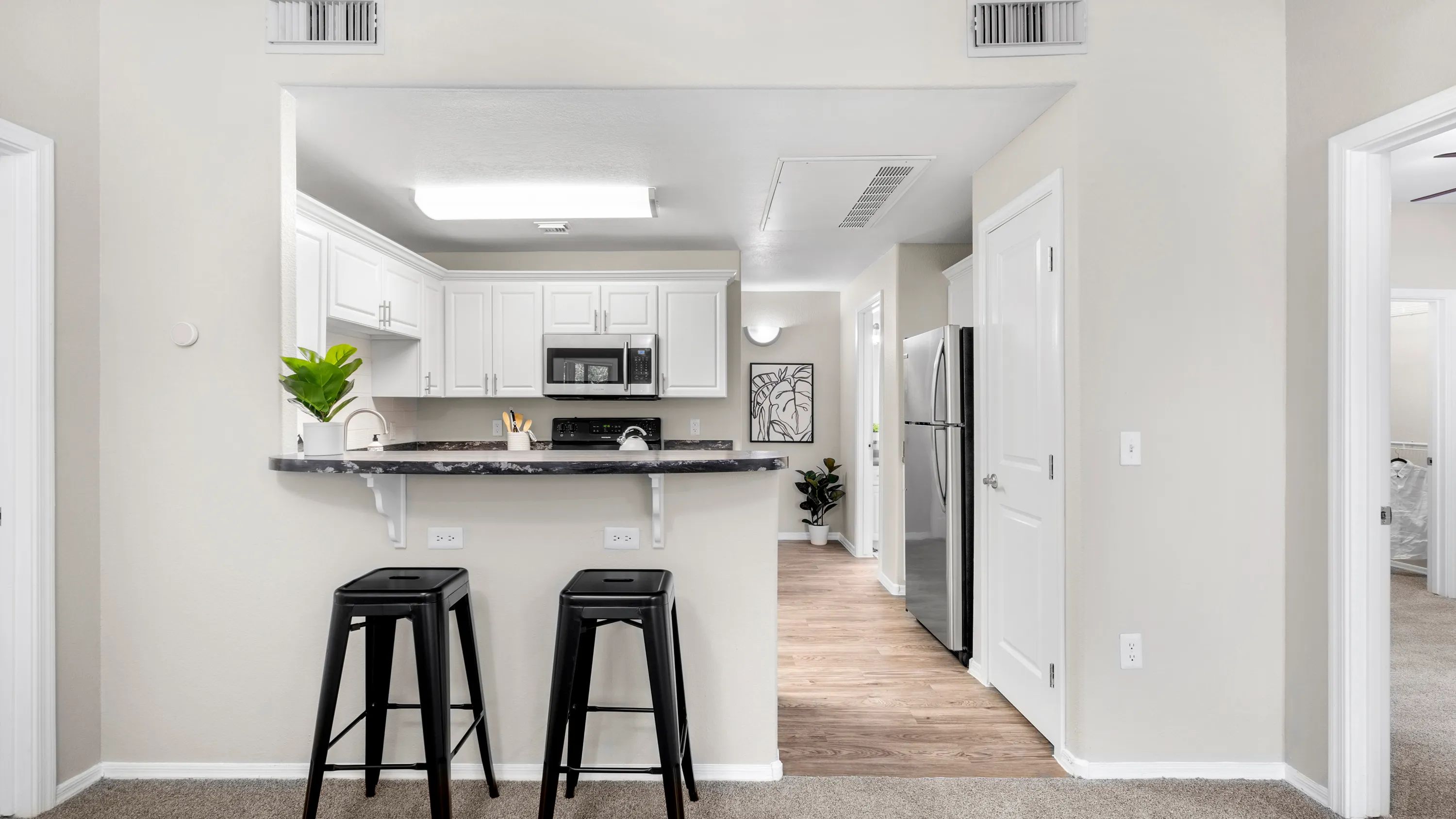 Savor breakfast bars that open up your kitchen to vibrant living spaces.