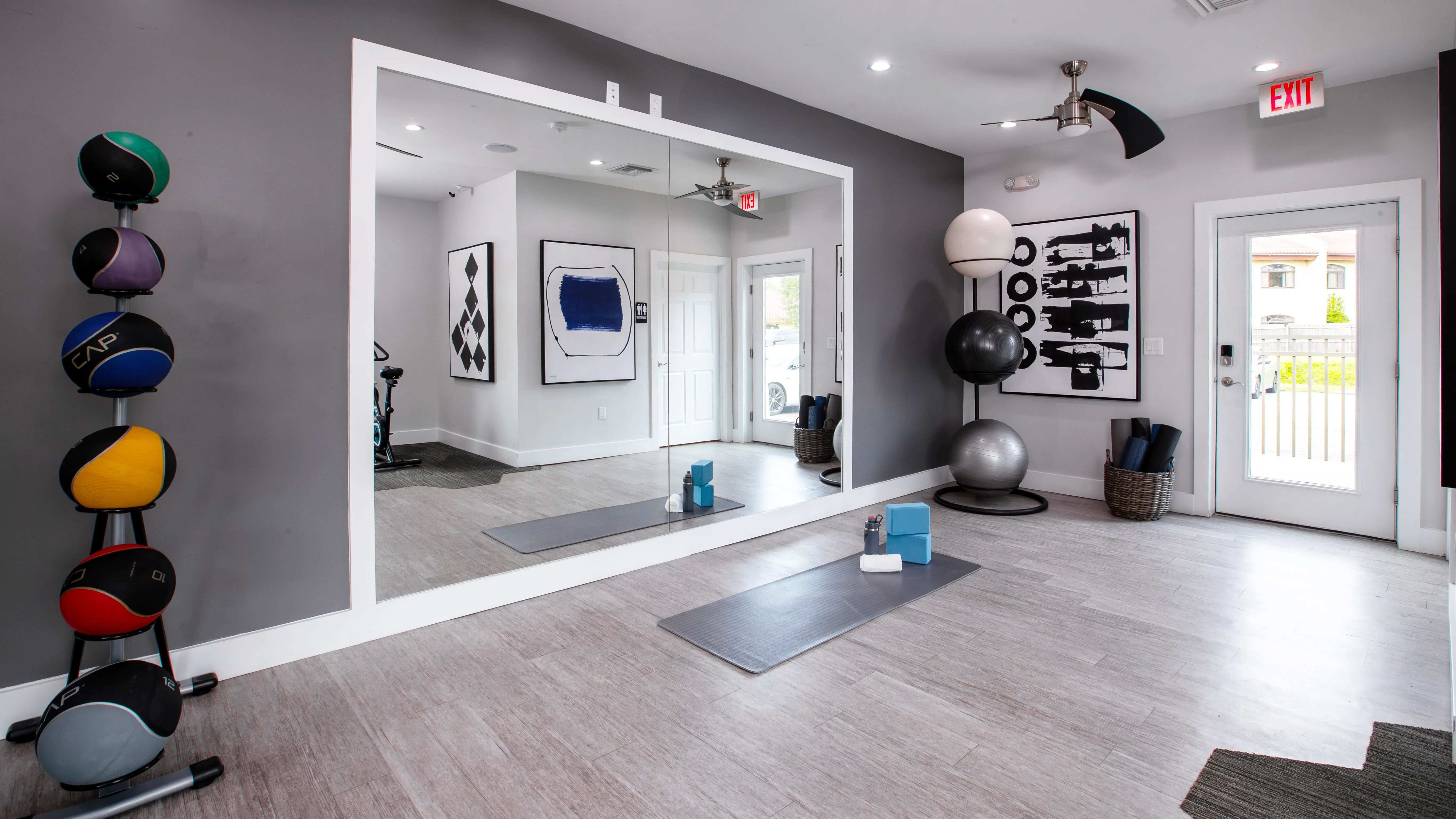 Find your zen in the dedicated yoga and stretching area in our fitness center. Complete with a full-length mirror, yoga mats, and exercise balls, this space is perfect for stretching, yoga, or a peaceful cooldown after your workout.