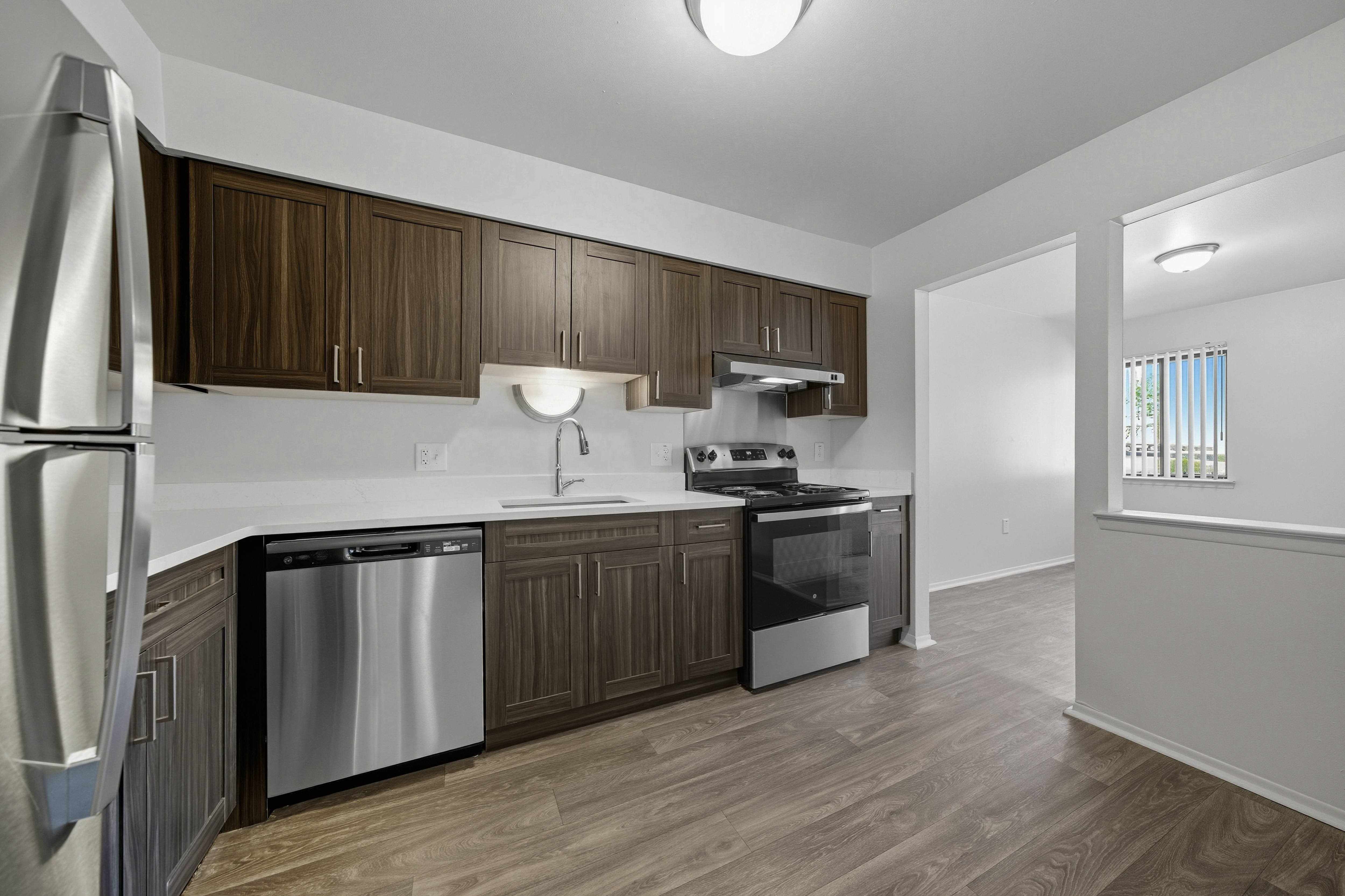 Modern kitchen with stainless steel appliances at Franklin River Apartments in Southfield, MI