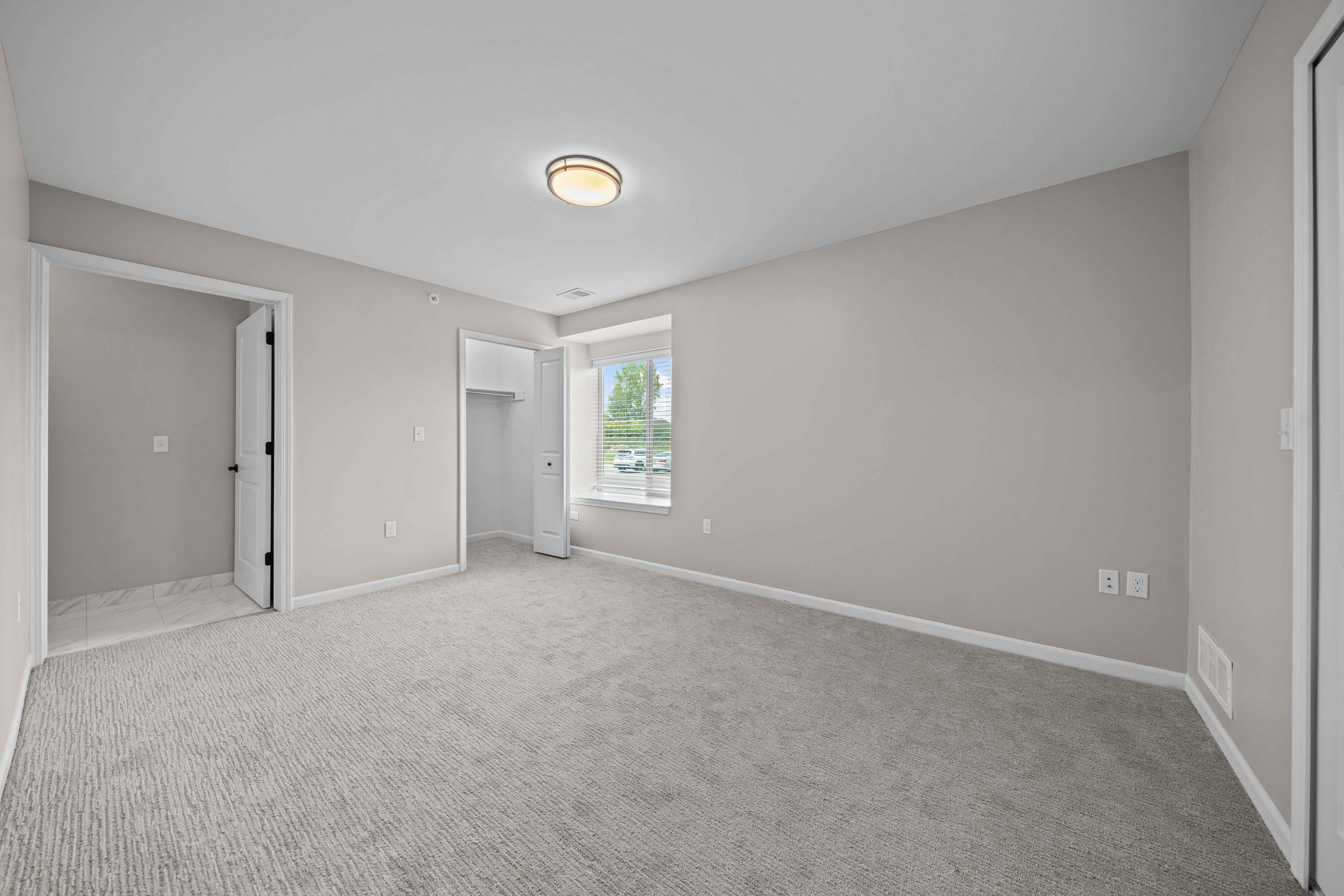 Bedroom with Ample storage space at The Reserve at Prentiss Pointe Apartments in Harrison Township, MI
