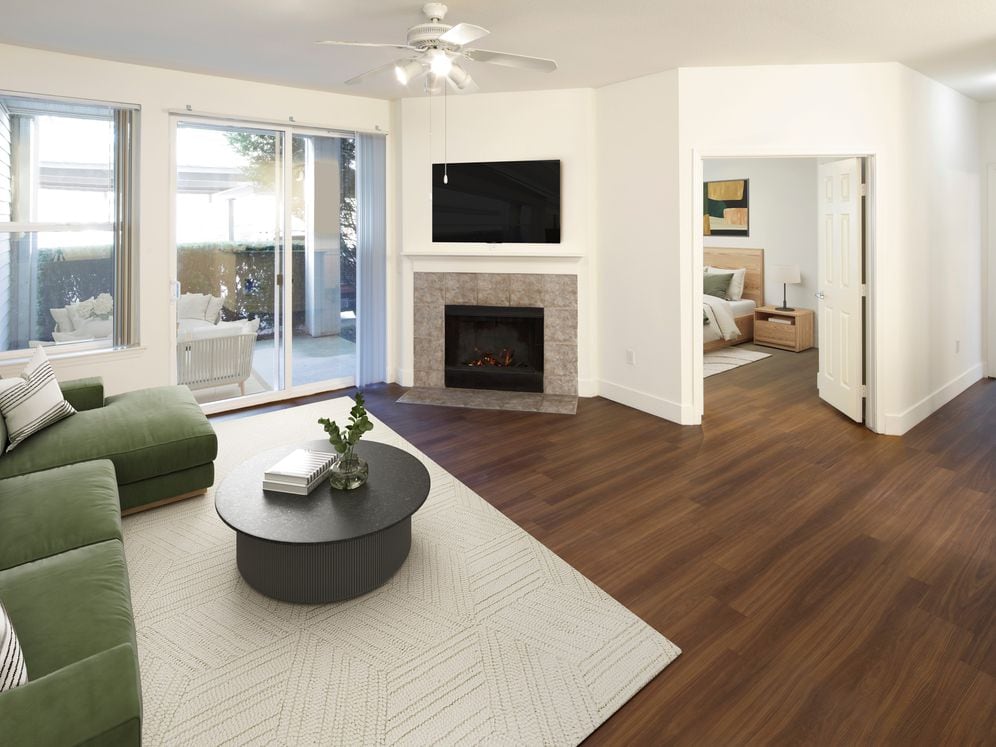 Living room with hard surface flooring (select homes)