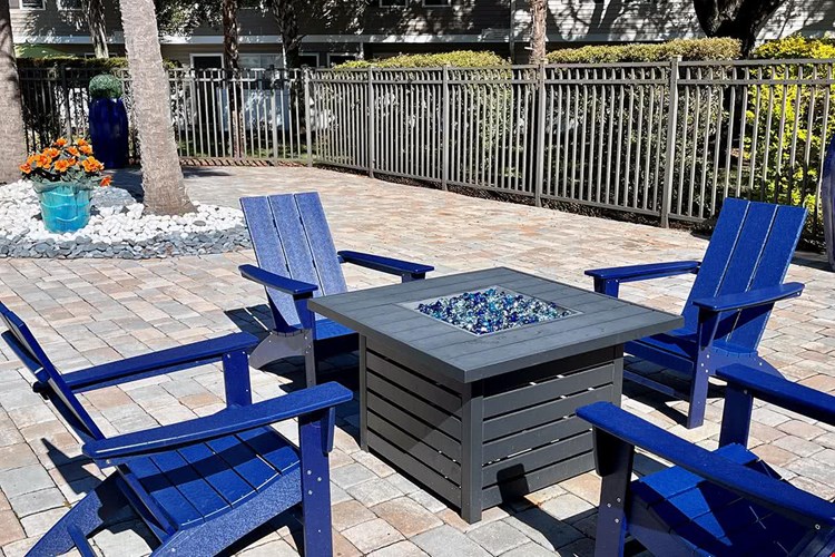 Warm up by our poolside firepit.