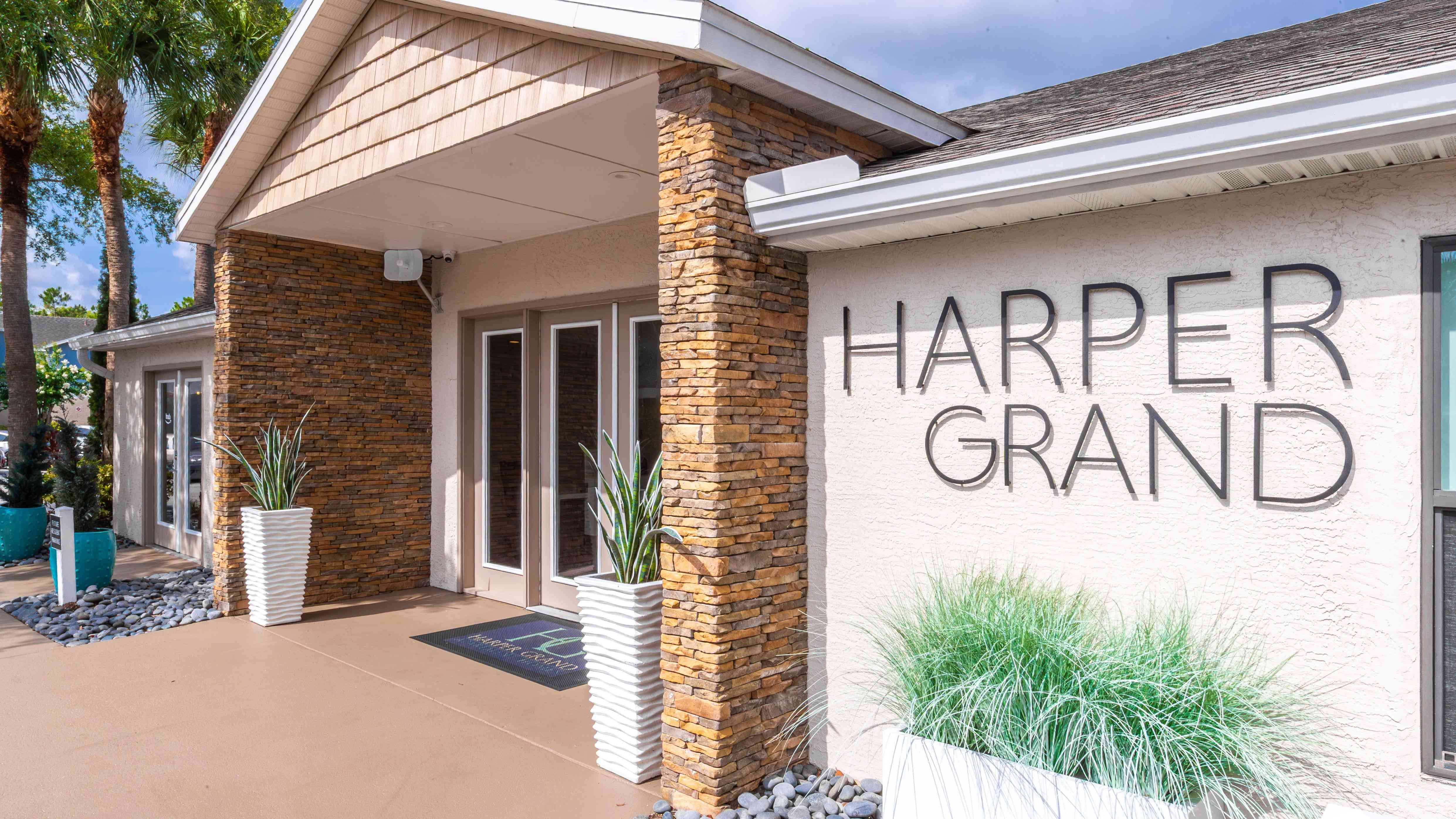 Make a great first impression at Harper Grand Apartments, where a beautifully designed clubhouse exterior sets the tone for resort-style living in Orlando, FL.