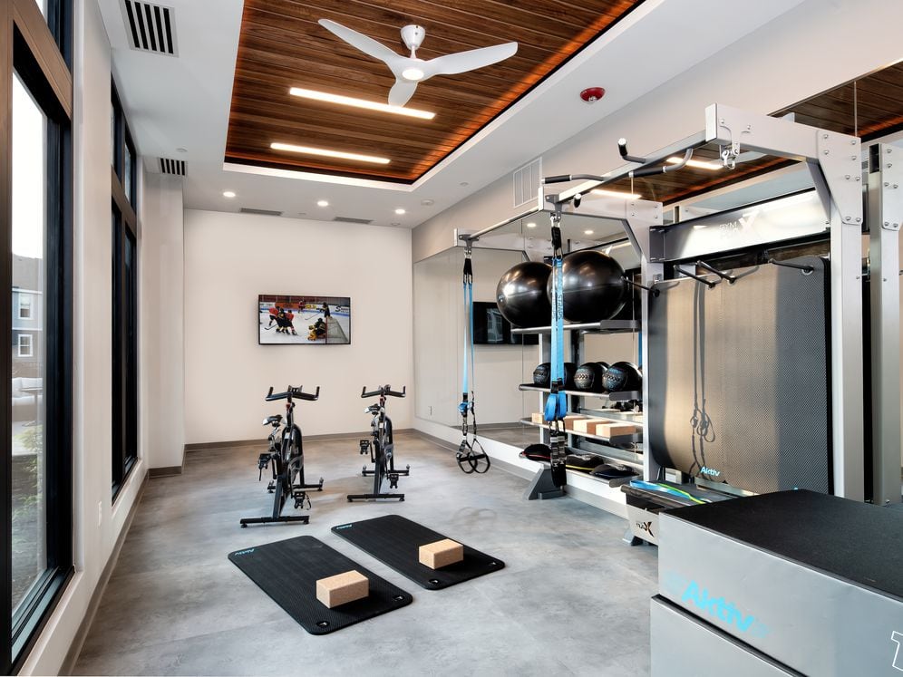 Fitness studio with spin bikes and TRX equipment
