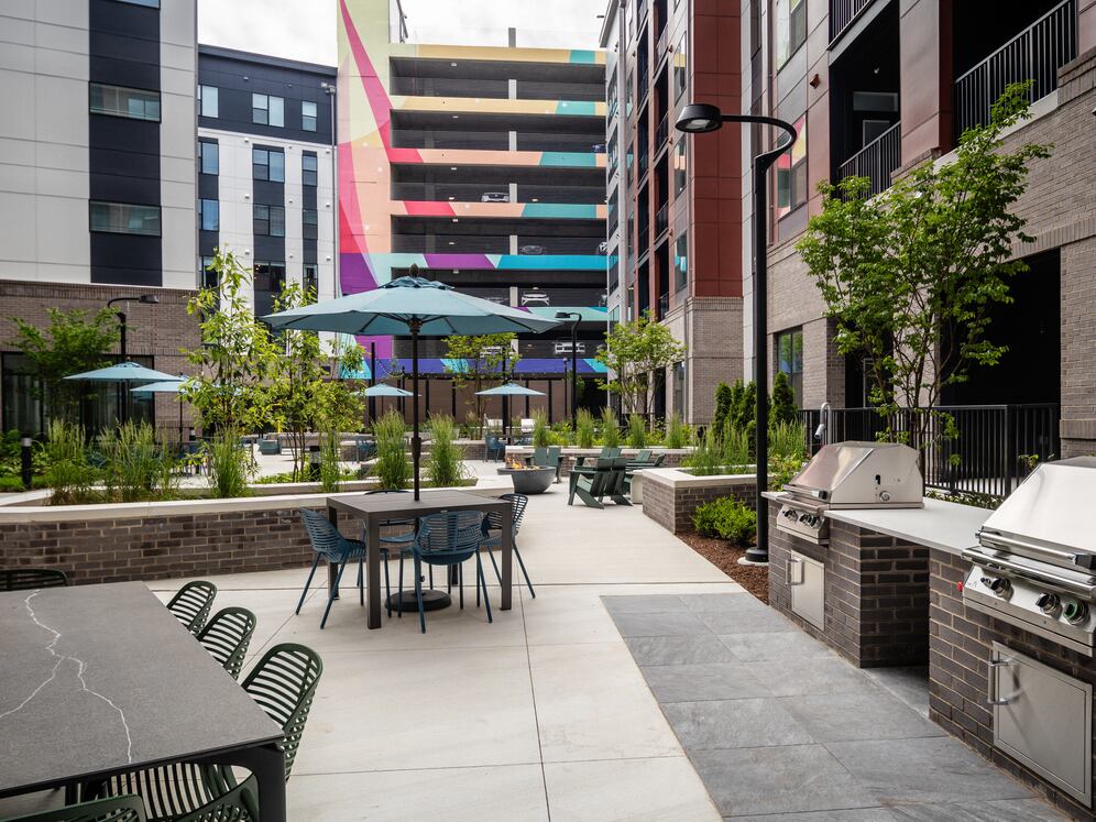 Courtyard #3 featuring fire pits, BBQ grills, and lounge areas