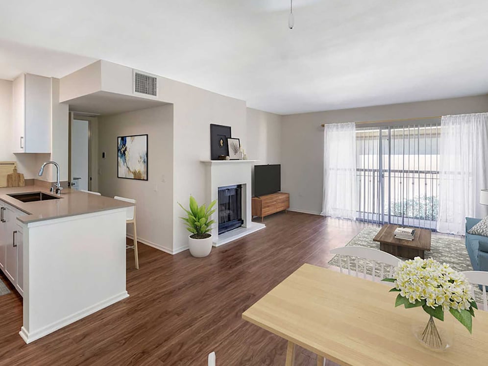 Renovated Package I kitchen, dining, and living area with hard surface flooring