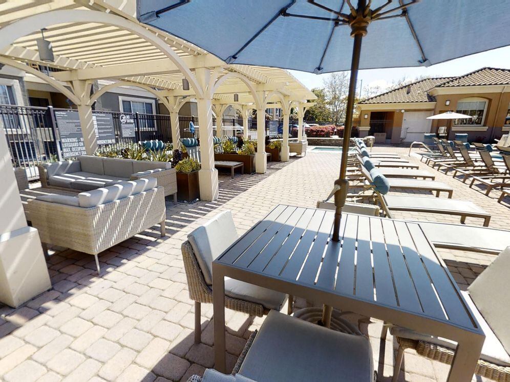 Pool and sundeck with lounge seating