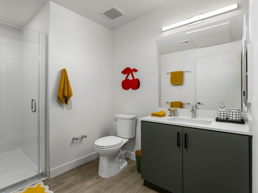 Finish Package II Bath with grey cabinetry, white quartz countertop, and hard-surface flooring
