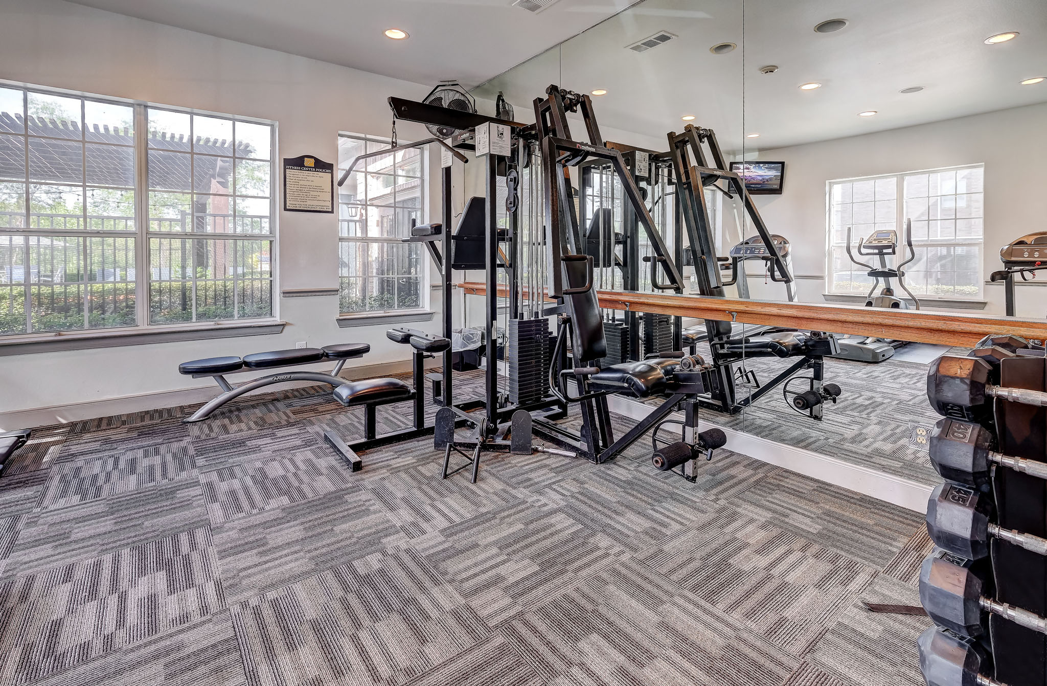 Fitness Center with treadmills and weight machines