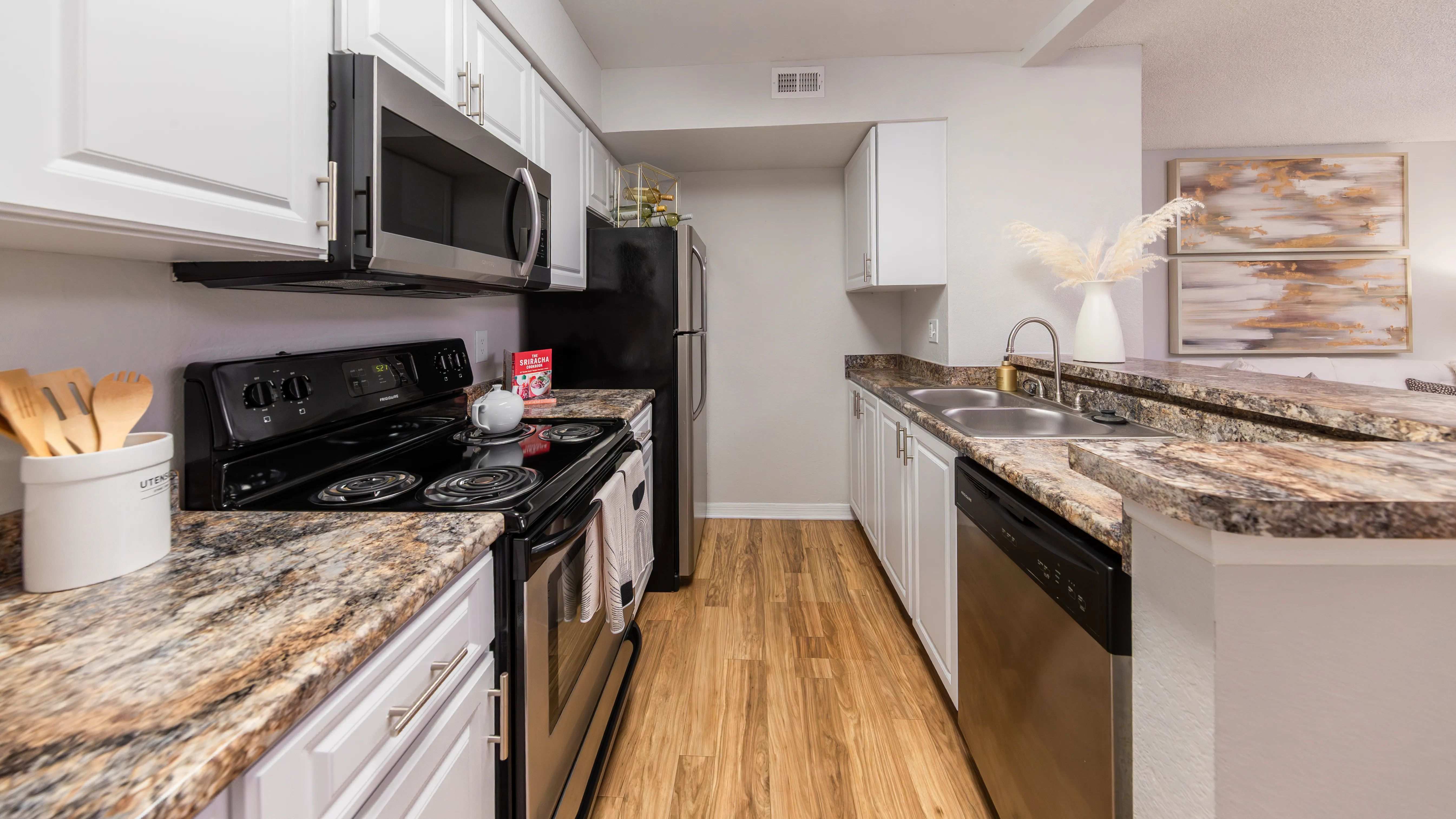 This galley-style kitchen offers stainless steel appliances, generous countertop space, and modern finishes—perfect for meal prep or entertaining guests.