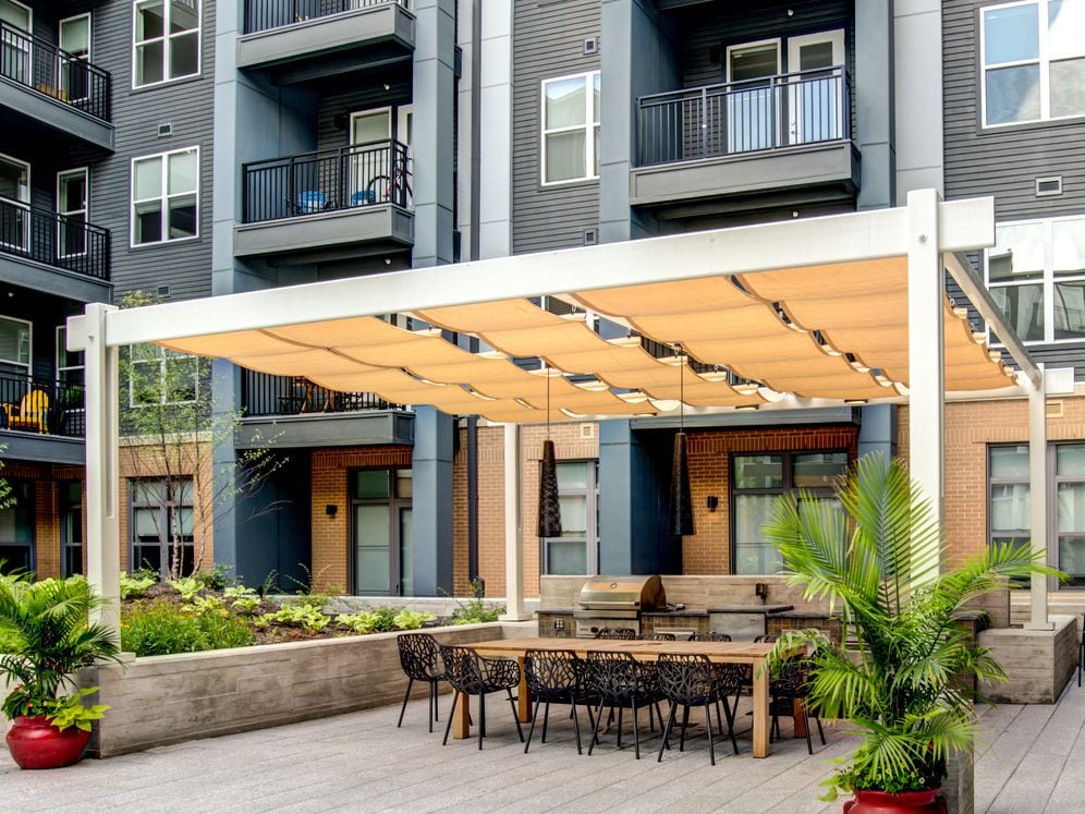 Courtyard with barbecue grills and entertaining kitchen with dining area