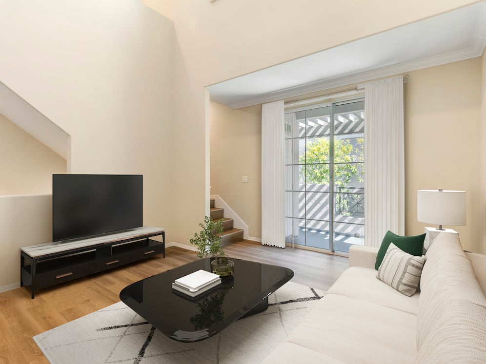 Renovated Package I living room with hard surface flooring