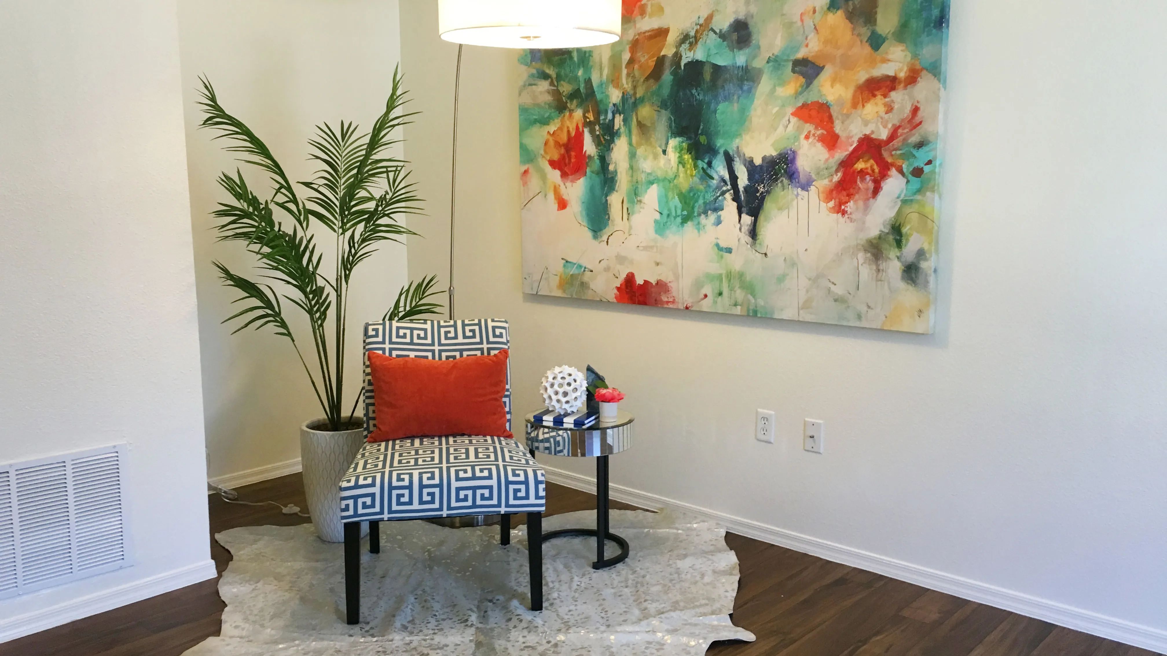 Relax in spacious living rooms with wood-style flooring, opening to your private patio.