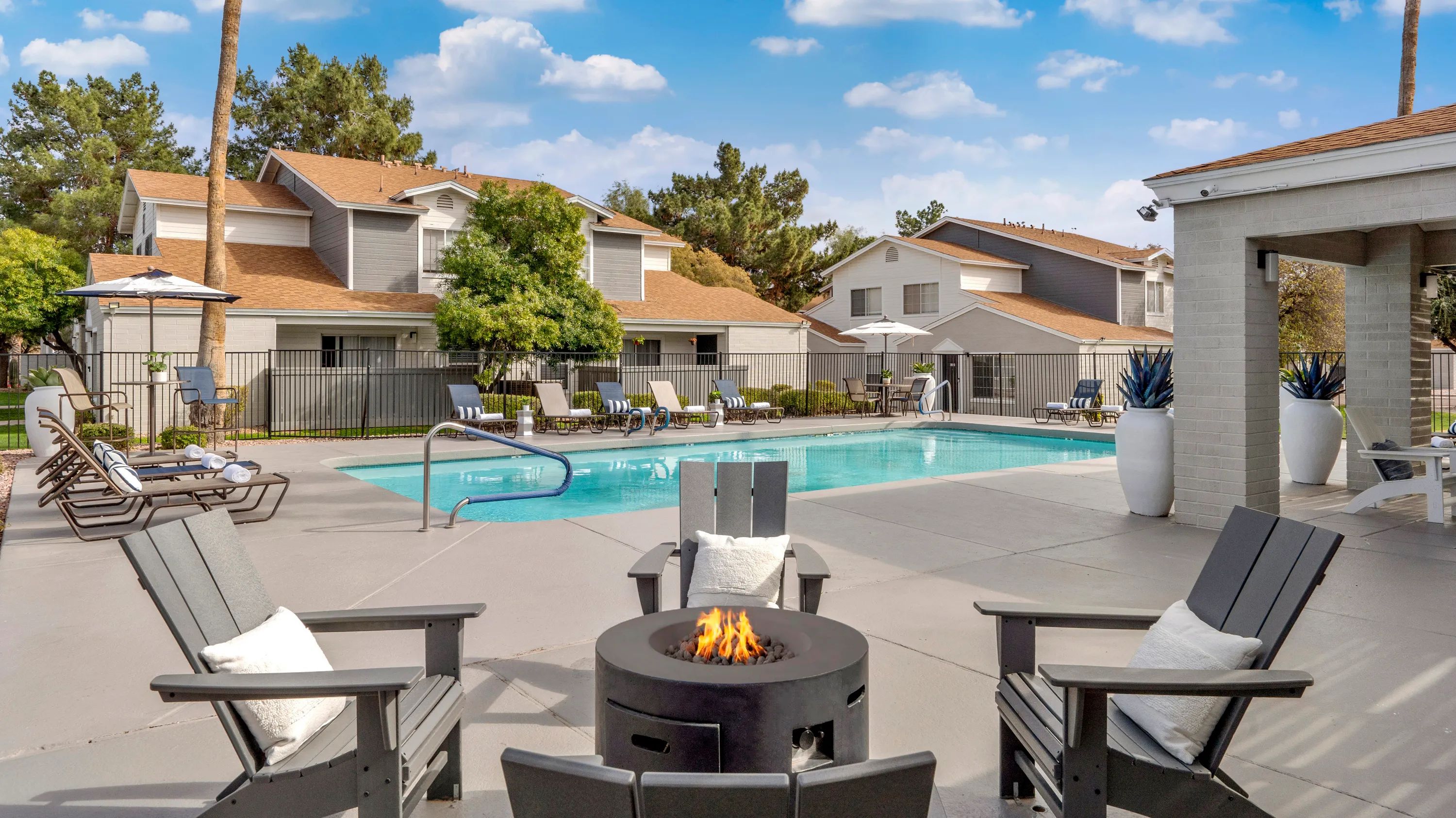 Embrace warmth and connection around our inviting poolside fire pit staged for delightful and cozy conversations – day or night. 