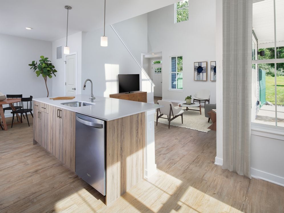 Upgrade Scheme townhome kitchen, dining, and living areas with hard surface flooring