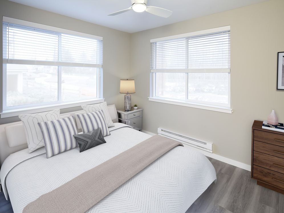 Bedroom with ceiling fan and hard surface flooring