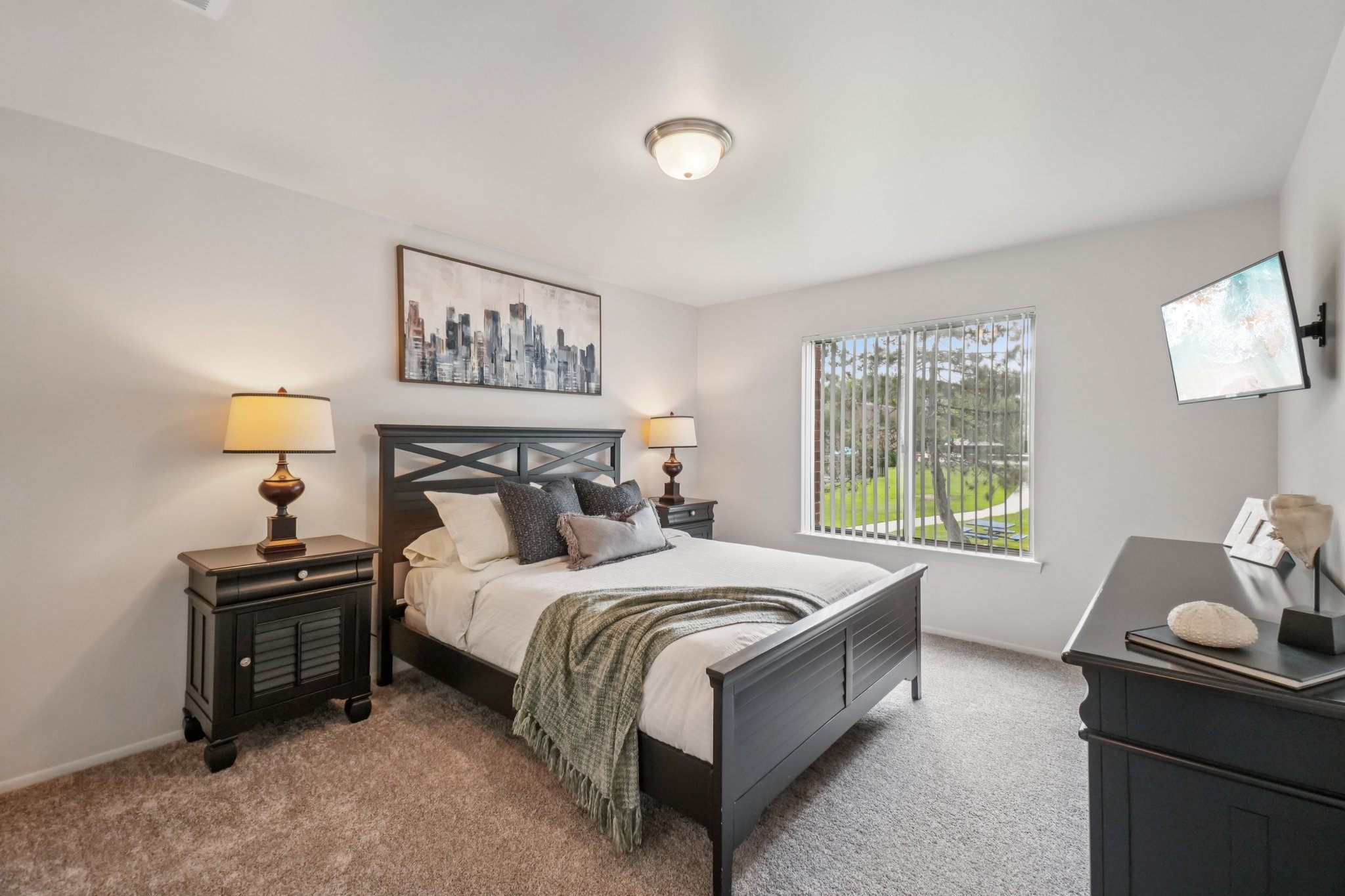Cozy bedroom with ample storage space at Drawbridge Apartments in Harrison Township, MI.