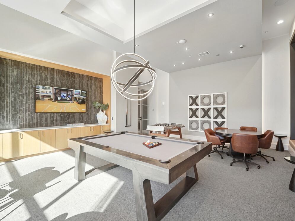 Game room with billiards and foosball