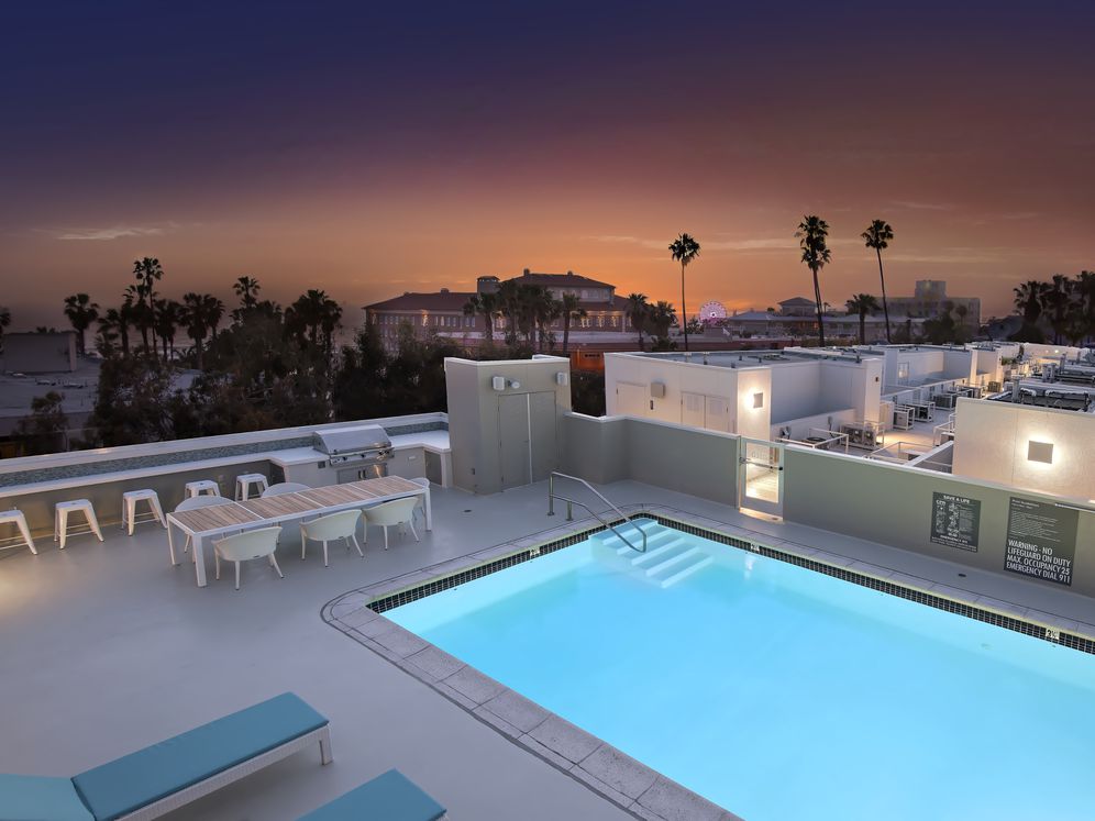 Rooftop Swimming Pool and BBQ Area with Seating