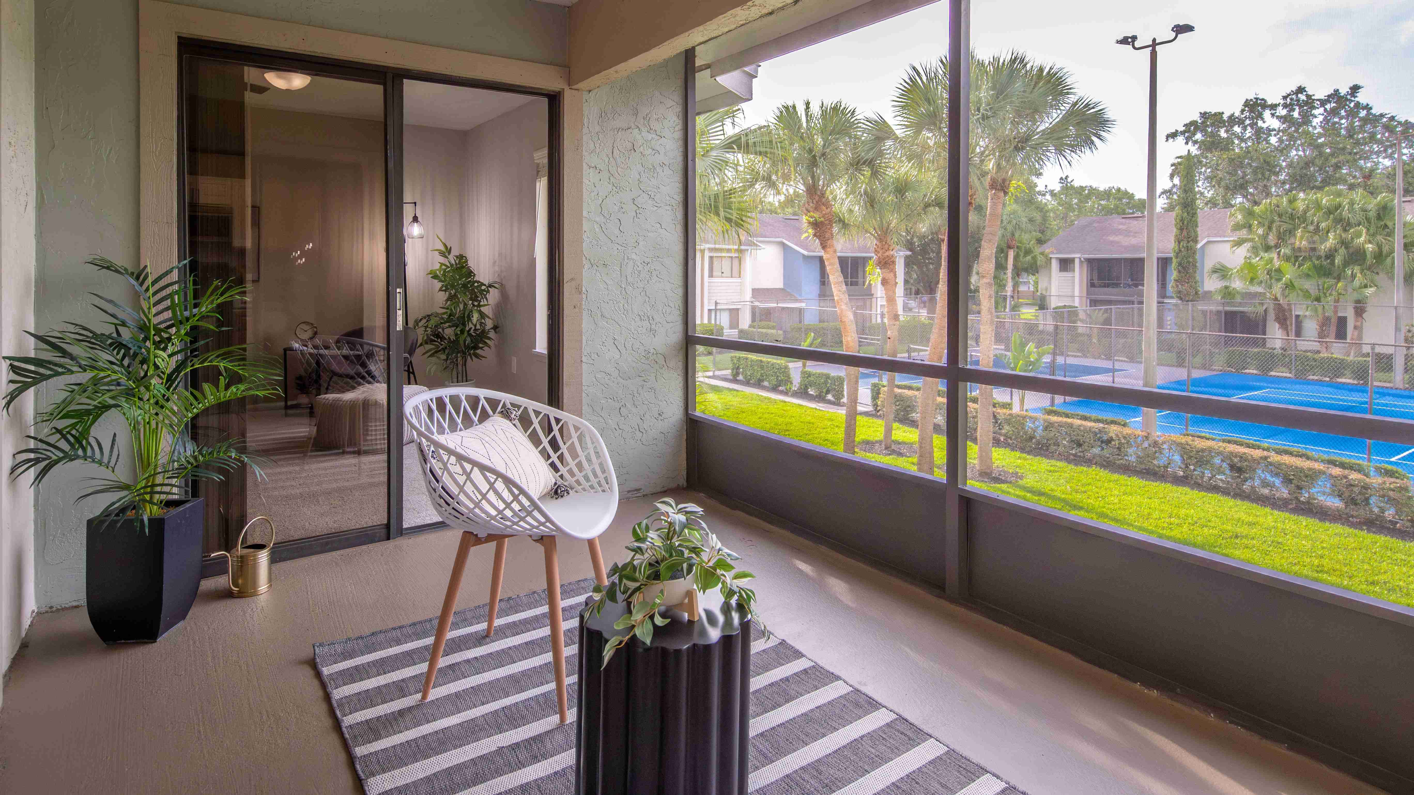 Get some fresh air from your private screened-in patio overlooking lush landscaping.