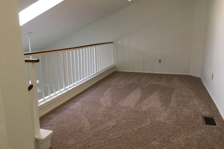 The spacious loft overlooks the living room