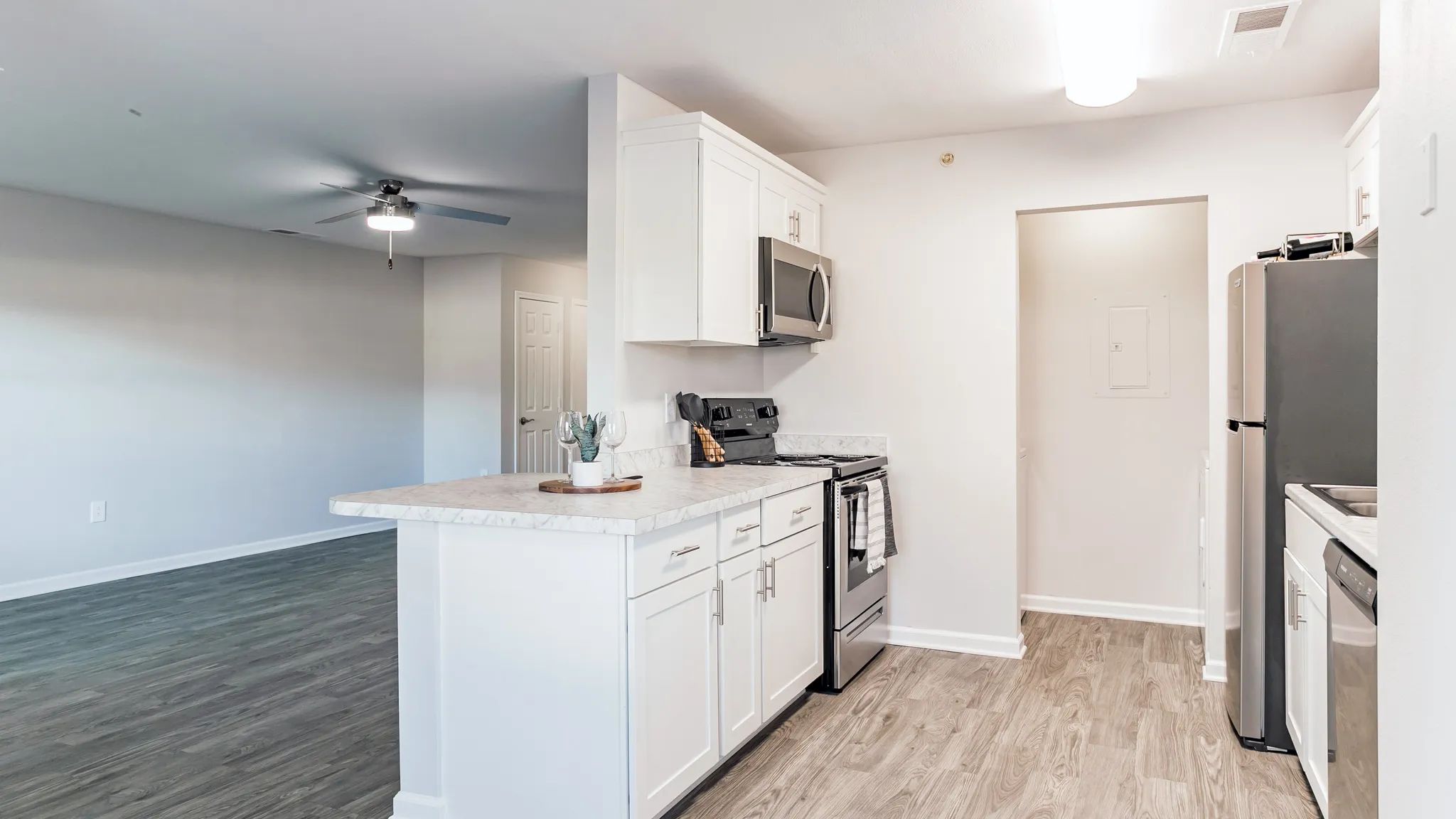Discover a culinary oasis in our one-bedroom floor plan with a galley-style kitchen. Granite-style countertops and stainless steel appliances elevate your cooking experience.