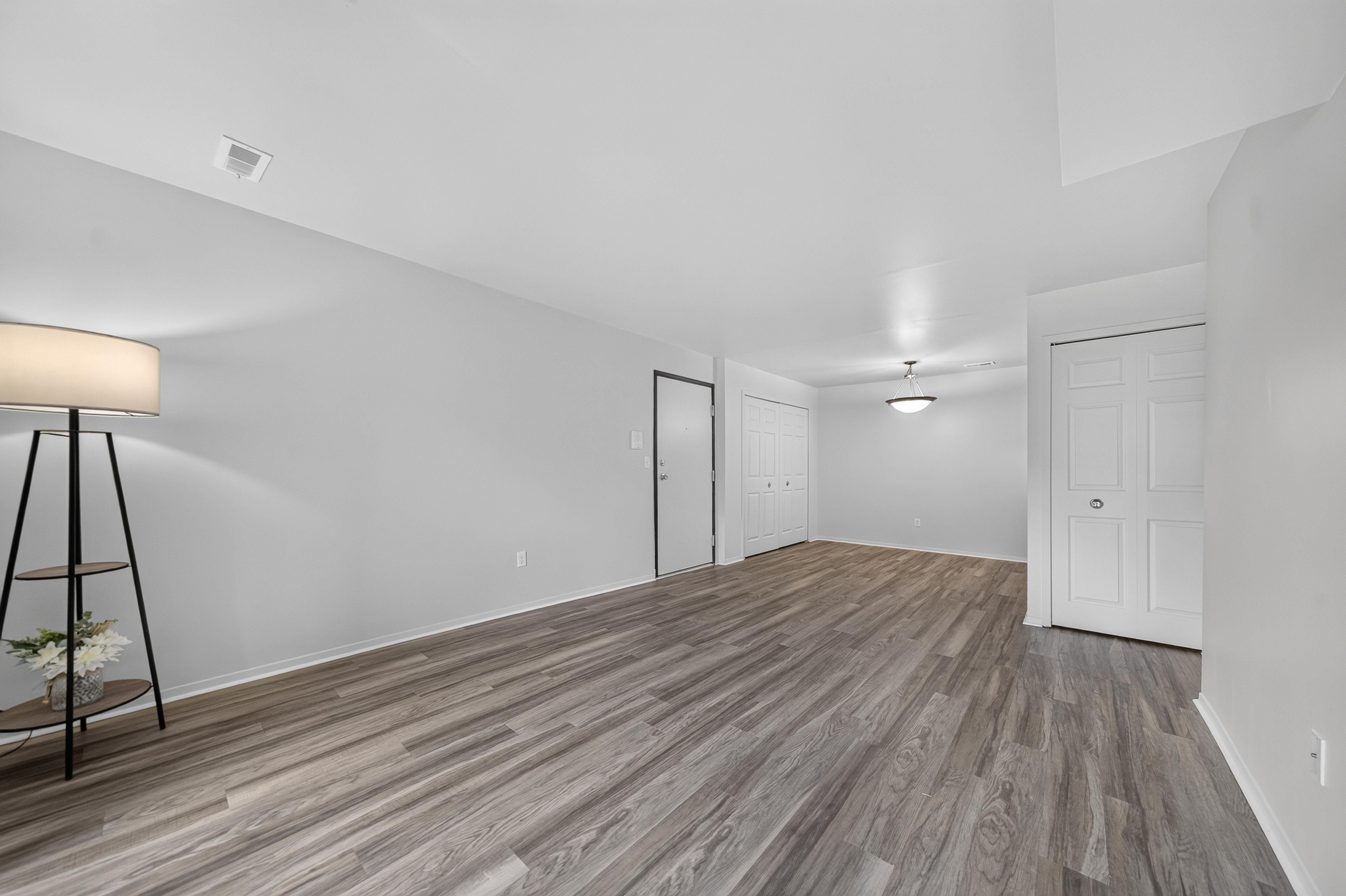 Spacious living and dining room at Woodland Villa Apartments in Westland, MI.