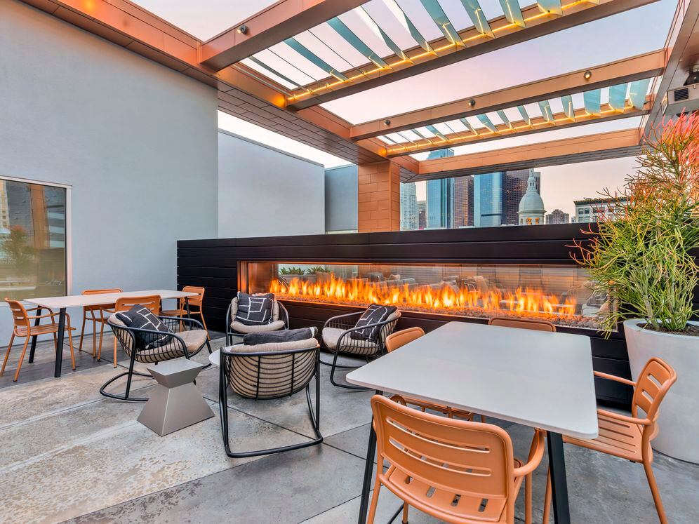 Rooftop with fireplace and lounge seating