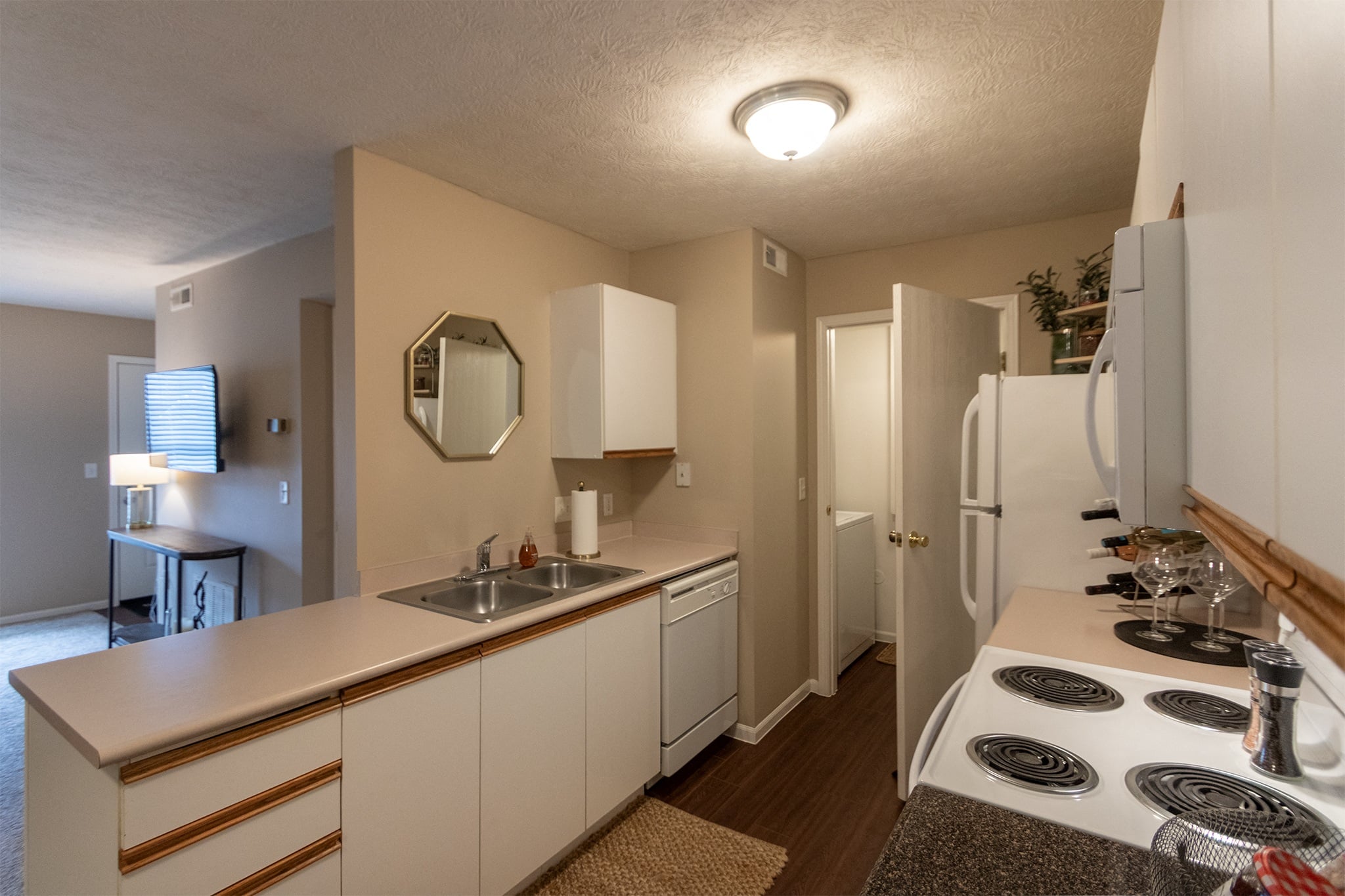 Our model Liberty kitchen features both upgraded cabinetry with dark countertops and classic cabinetry with light countertops.