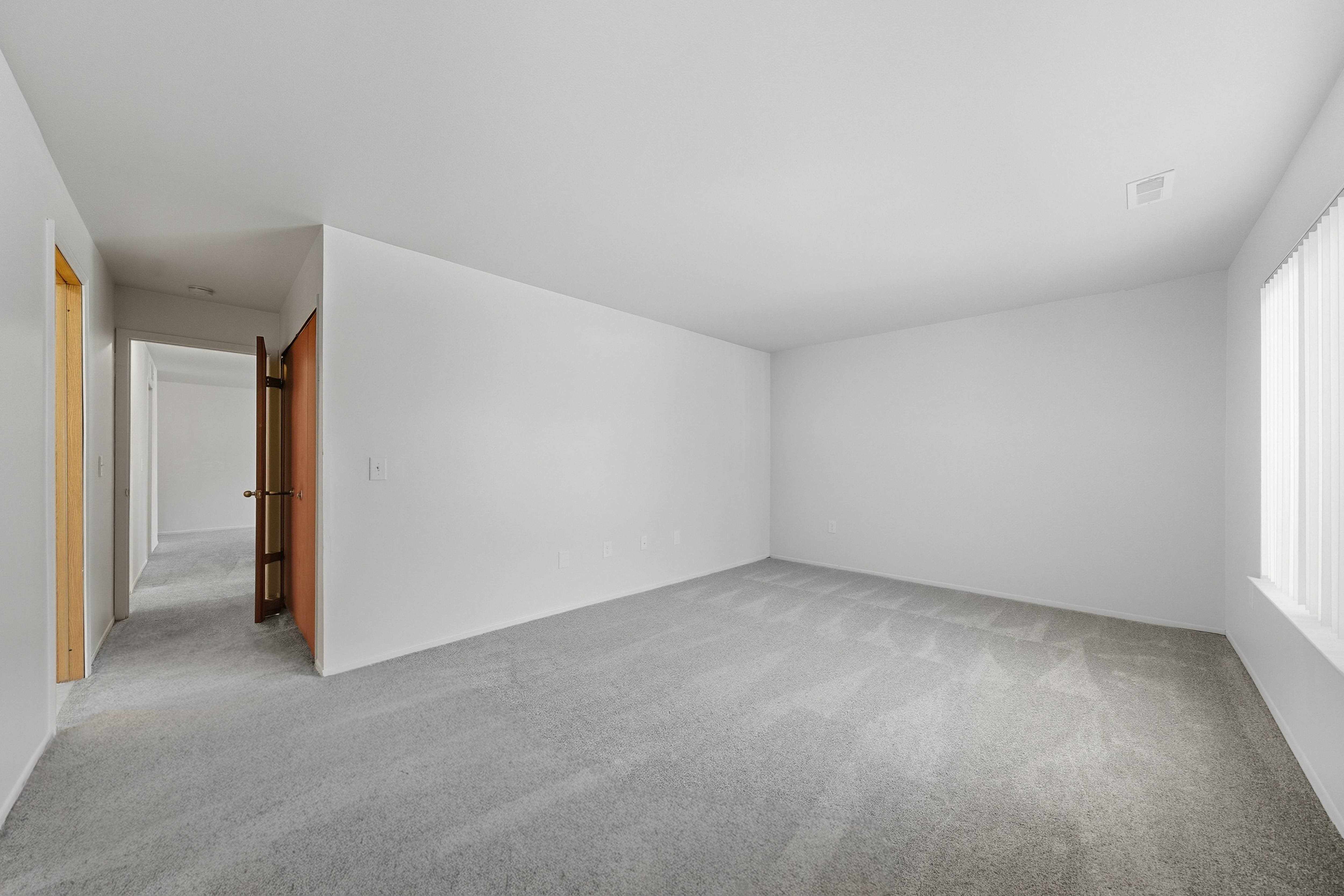 Comfortable Bedroom with natural light at Franklin River Apartments in Southfield, MI