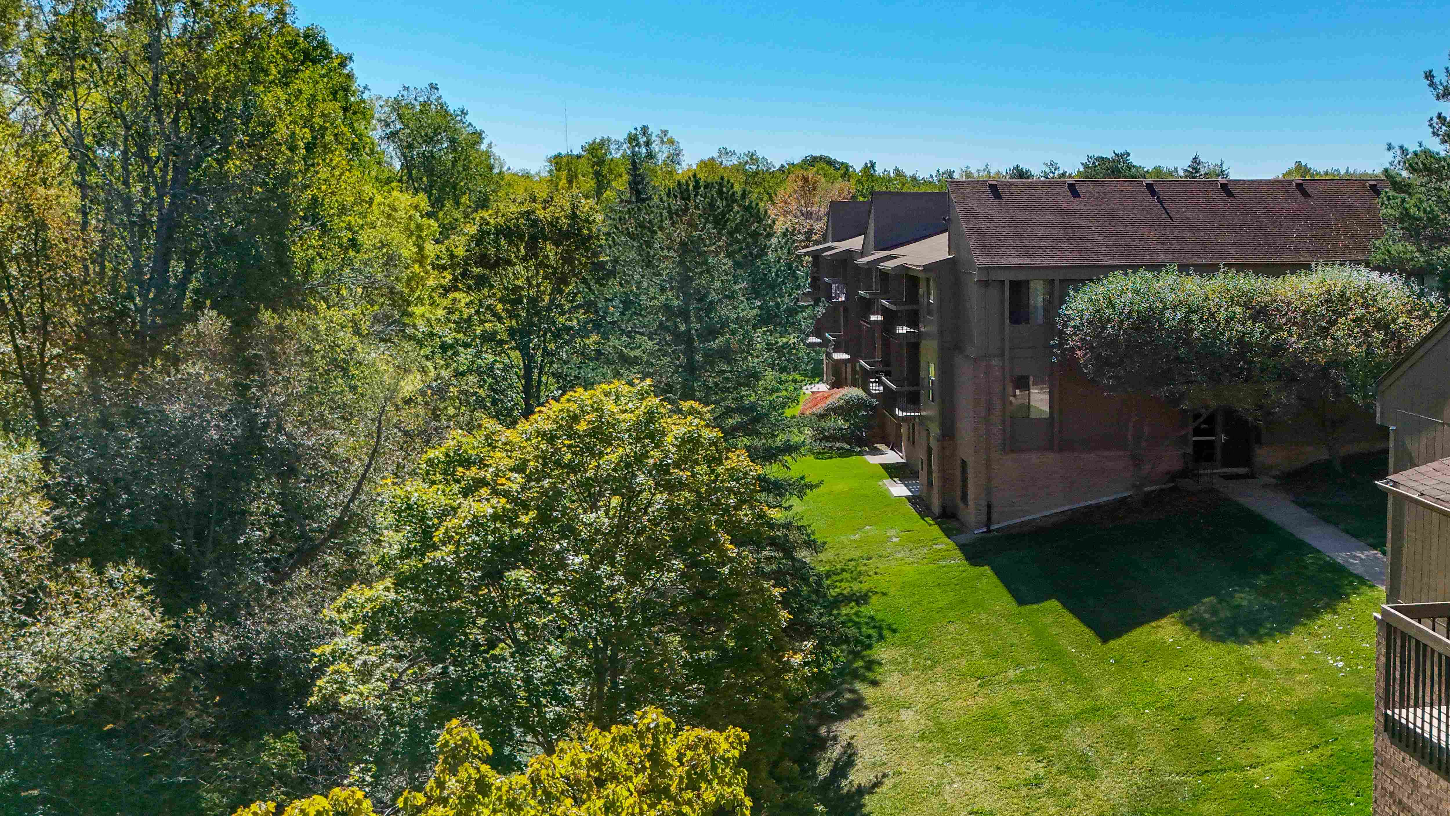 Expansive Green Space Apartment Building Exterior at Franklin River Apartments, Southfield, MI