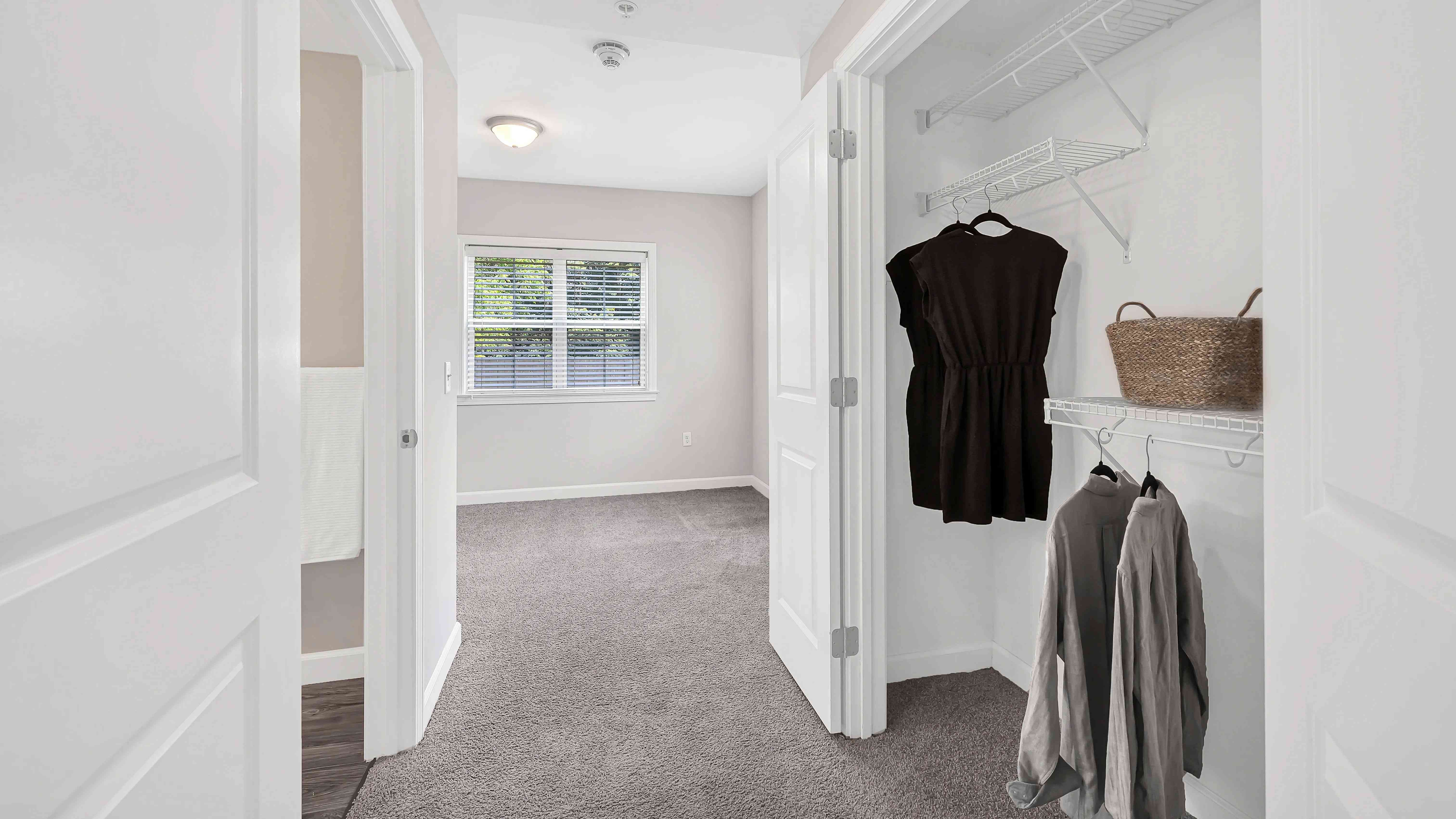Step into the ultimate closet experience with double doors and wire shelving organizers in our 4 bed 4 bath floor plan. Your dream storage to hold all your style awaits!