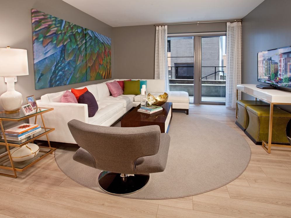 Living area with hard surface flooring and balcony