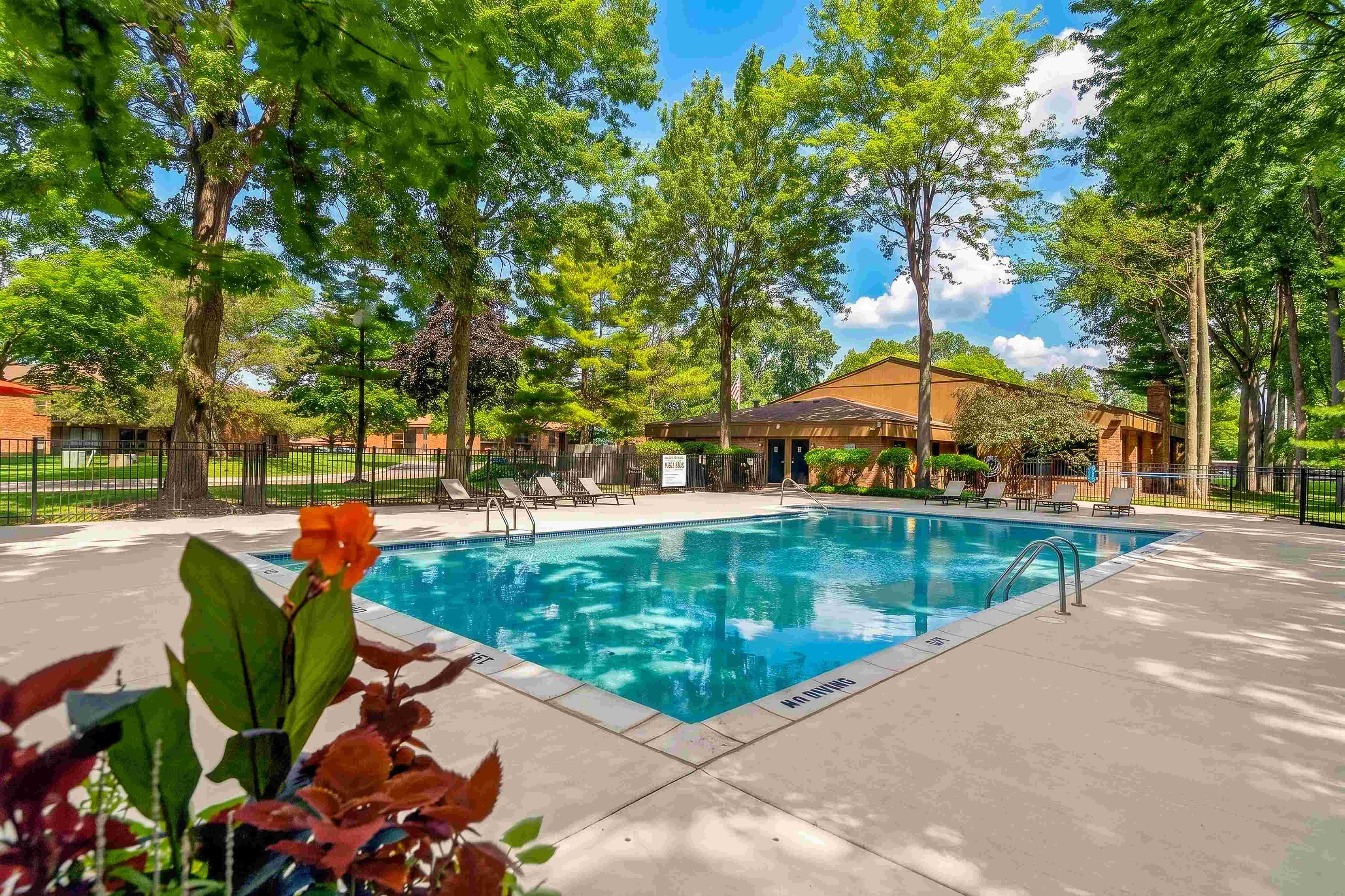 Heated pool with sundeck at Eastwood Village Apartments in Clinton Township, MI.