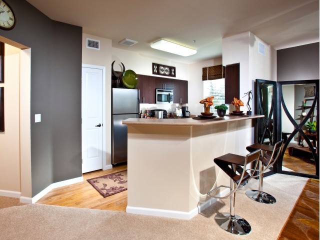 The Alterra finish package includes espresso cabinets and black and silver appliances