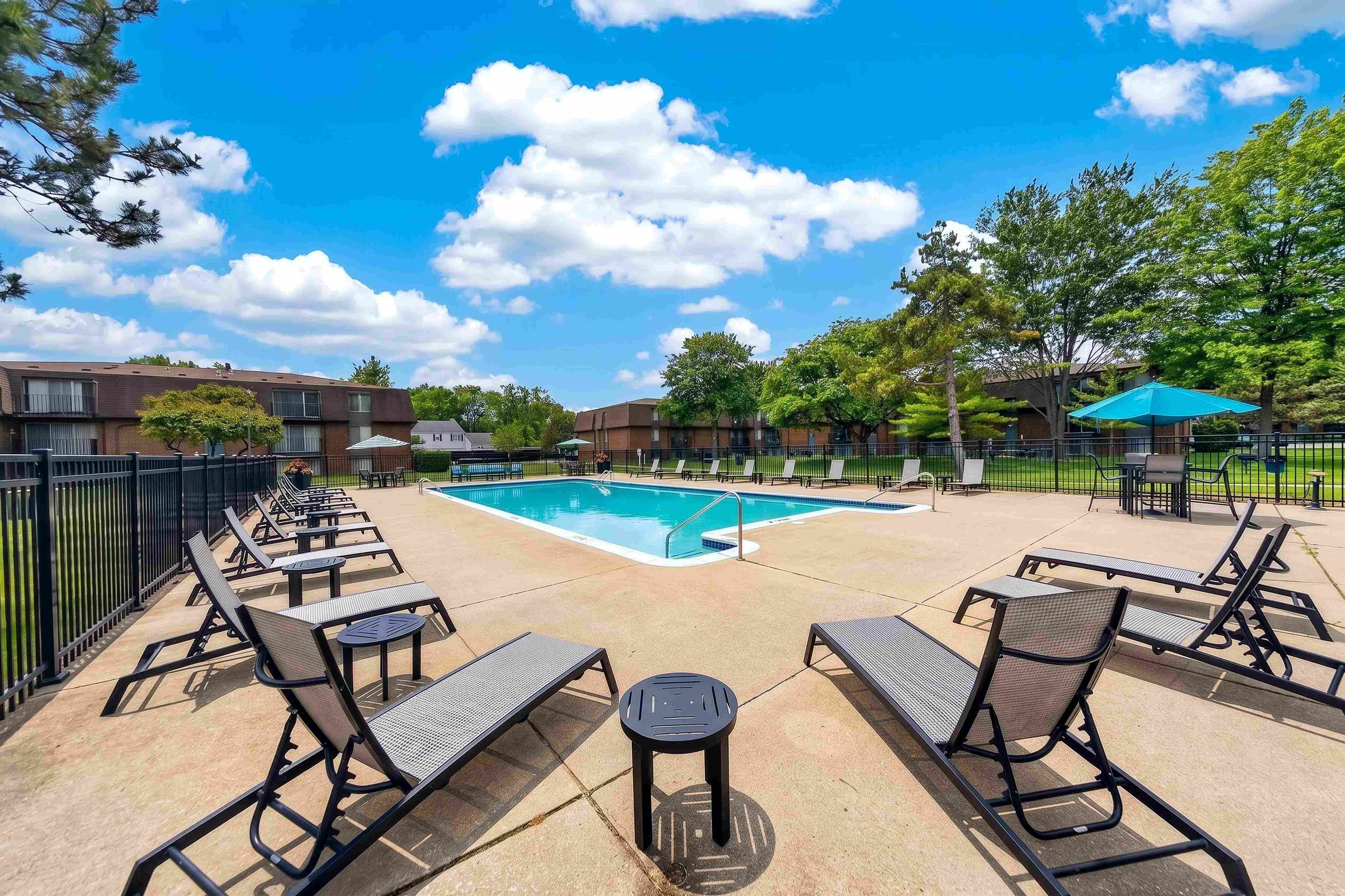 Heated pool and sundeck at Drawbridge Apartments in Harrison Township, MI.