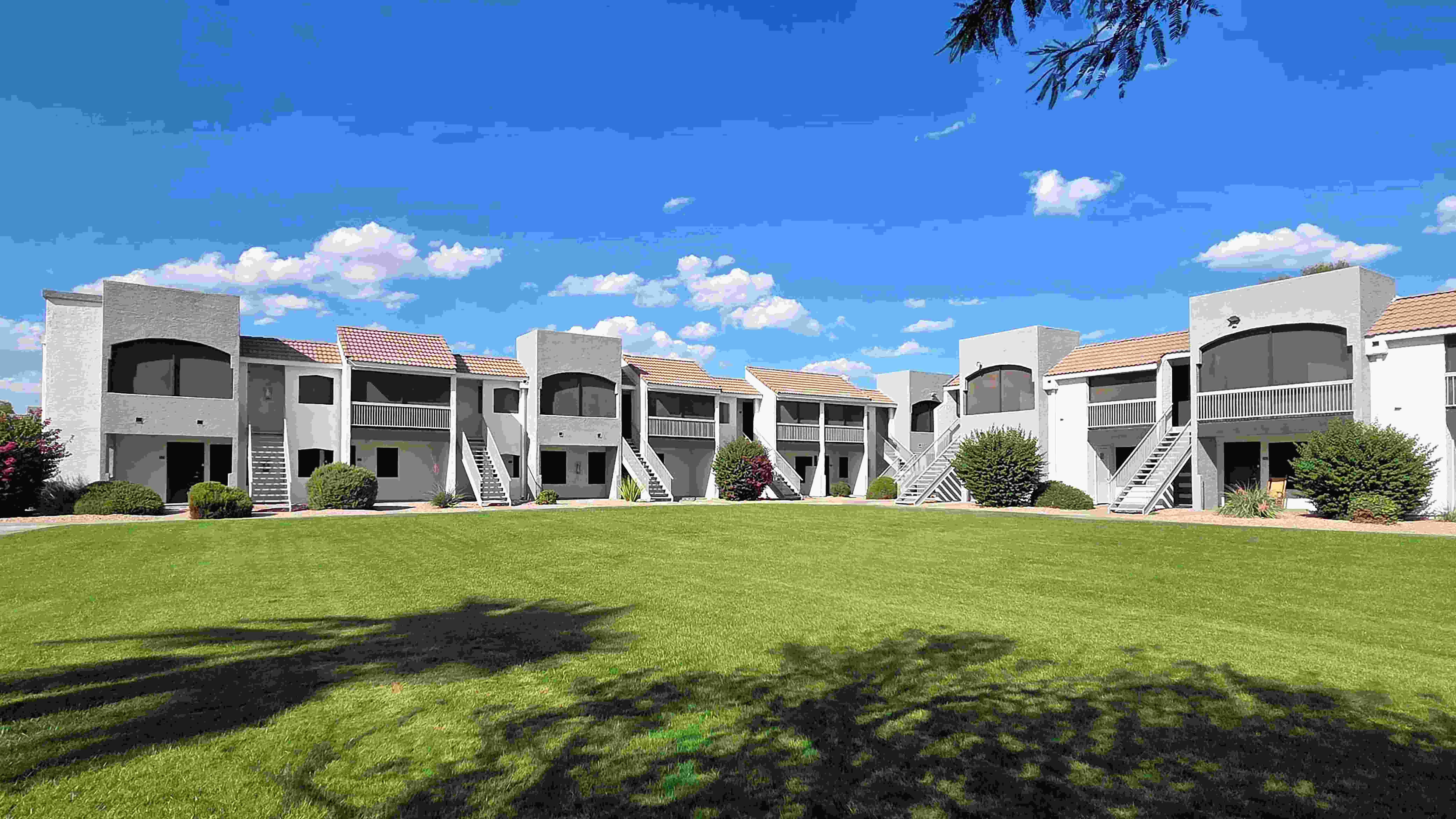 Enjoy the open-air setting at Level 550, where expansive green space, mature landscaping, and distinctive apartment exteriors create an inviting backdrop for everyday living.