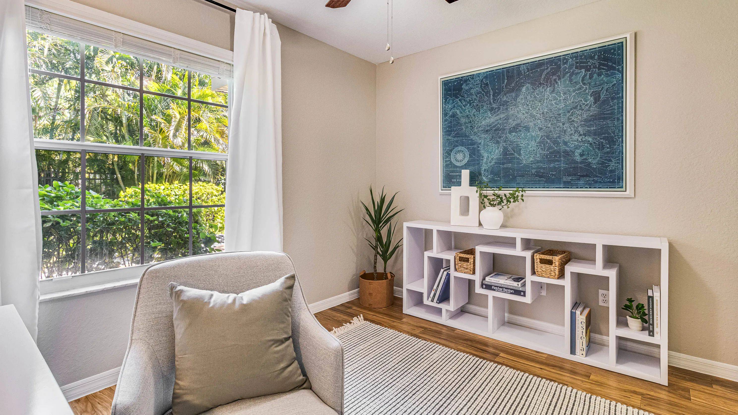 Spacious bedrooms boast well-organized closets, large windows, and ceiling fans.