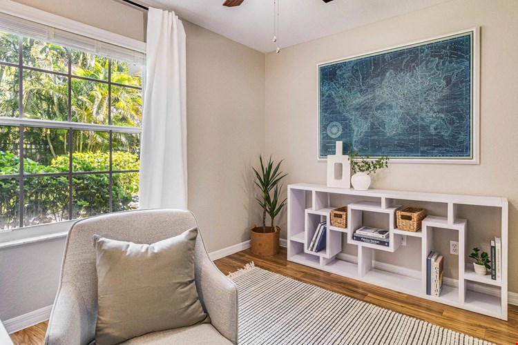 Spacious bedrooms boast well-organized closets, large windows, and ceiling fans.