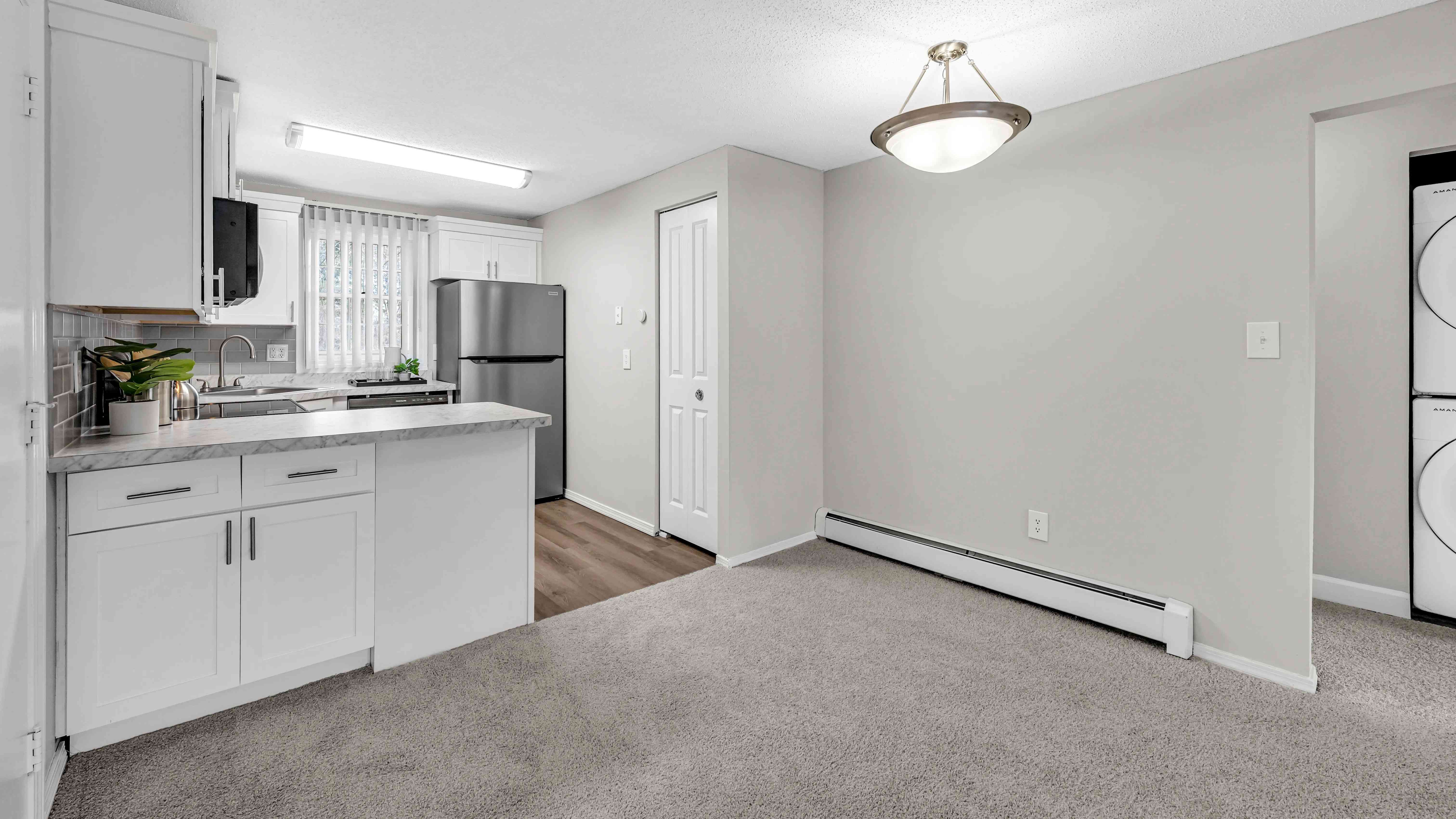 Savor meals in the separate dining area, uniting the living and kitchen spaces. 
