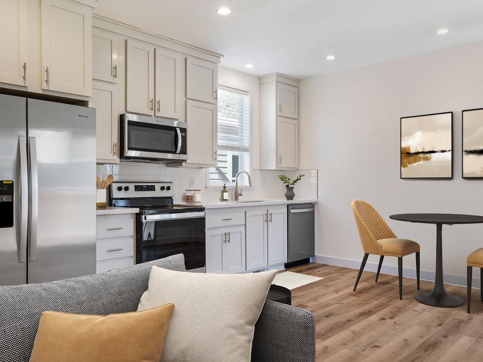 Freestanding Home kitchen and dining room with hard surface flooring