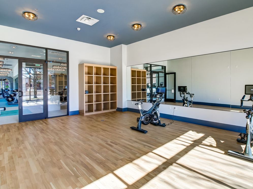 Yoga studio with spin bikes and virtual fitness programming