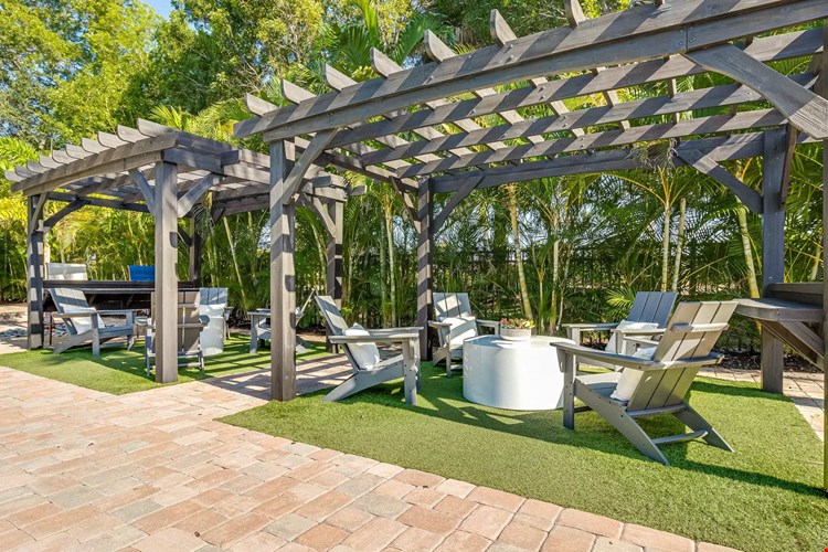 Relax in shaded comforts beneath our poolside pergolas.